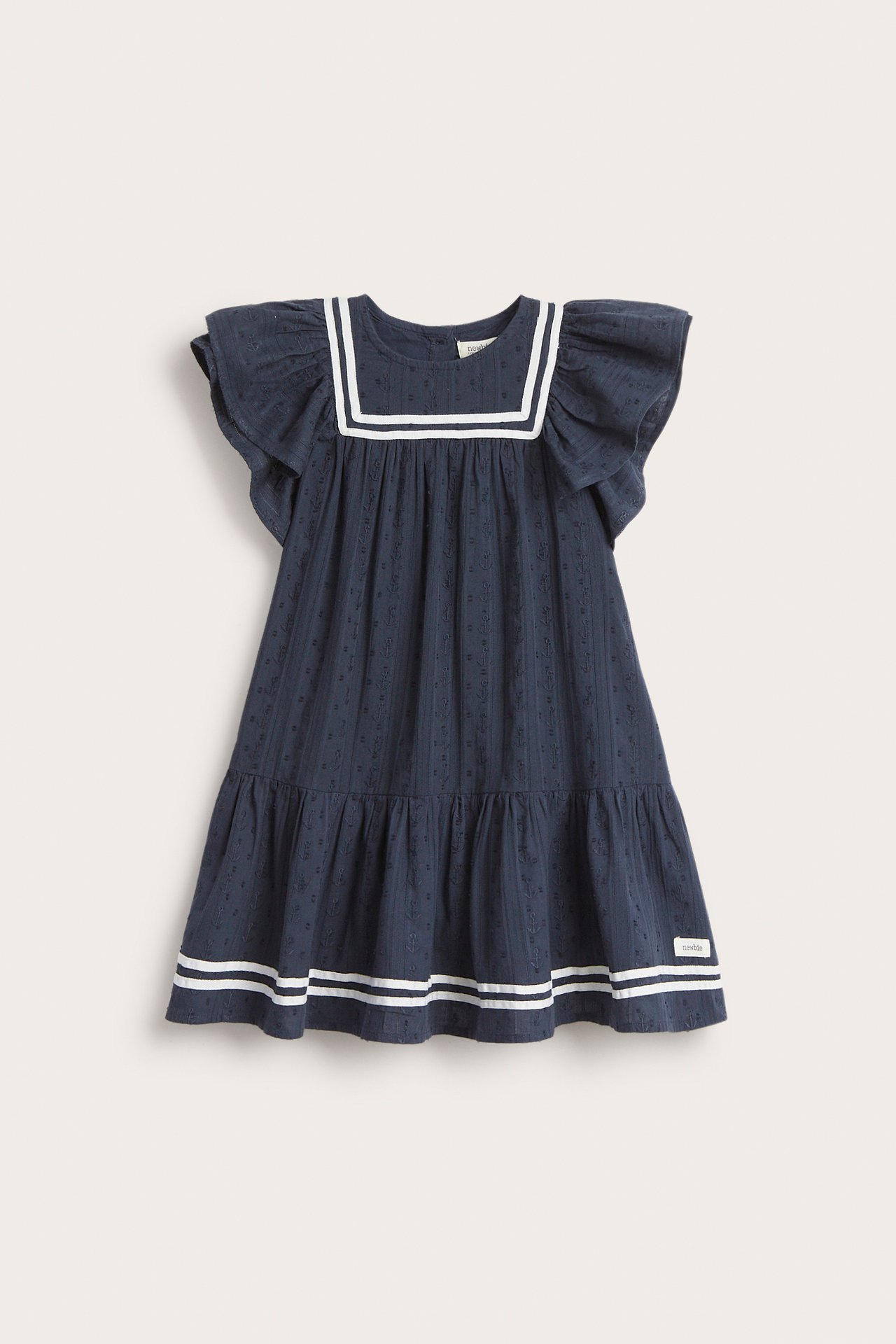 Vorderansicht: Dunkelblaues Kinder-Dobby-Baumwollkleid mit weißem Matrosenkragen, Rüschenärmeln und gestreiftem Saum.