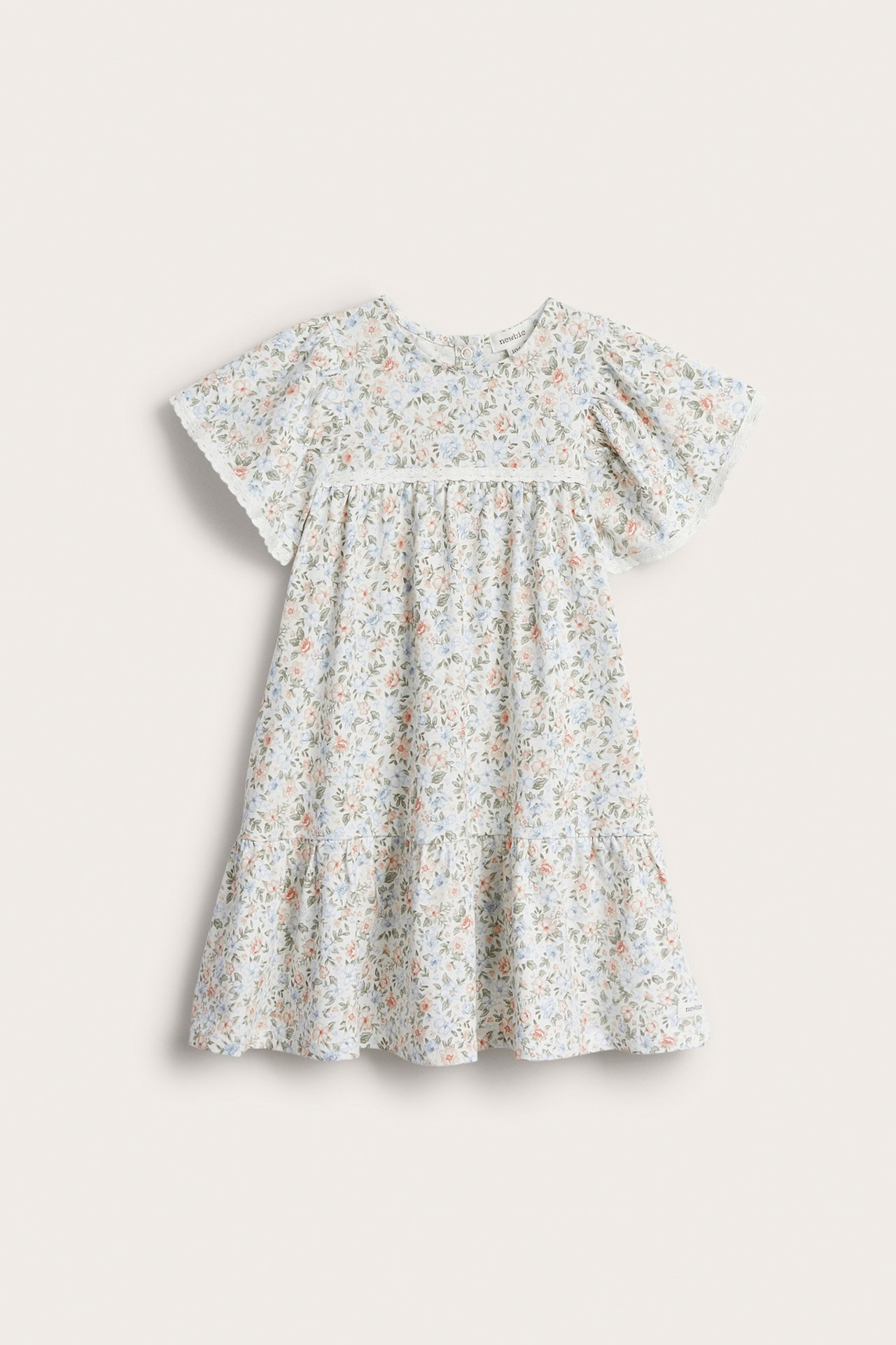 Vorderansicht: Off-weißes Kinder-Baumwollkleid mit kleinem Blumenmuster und Spitzenbesatz.