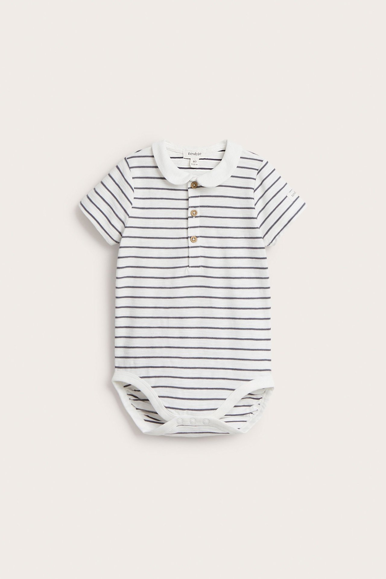 Front view of a baby's off-white striped short-sleeved cotton bodysuit with a white collar and front buttons.