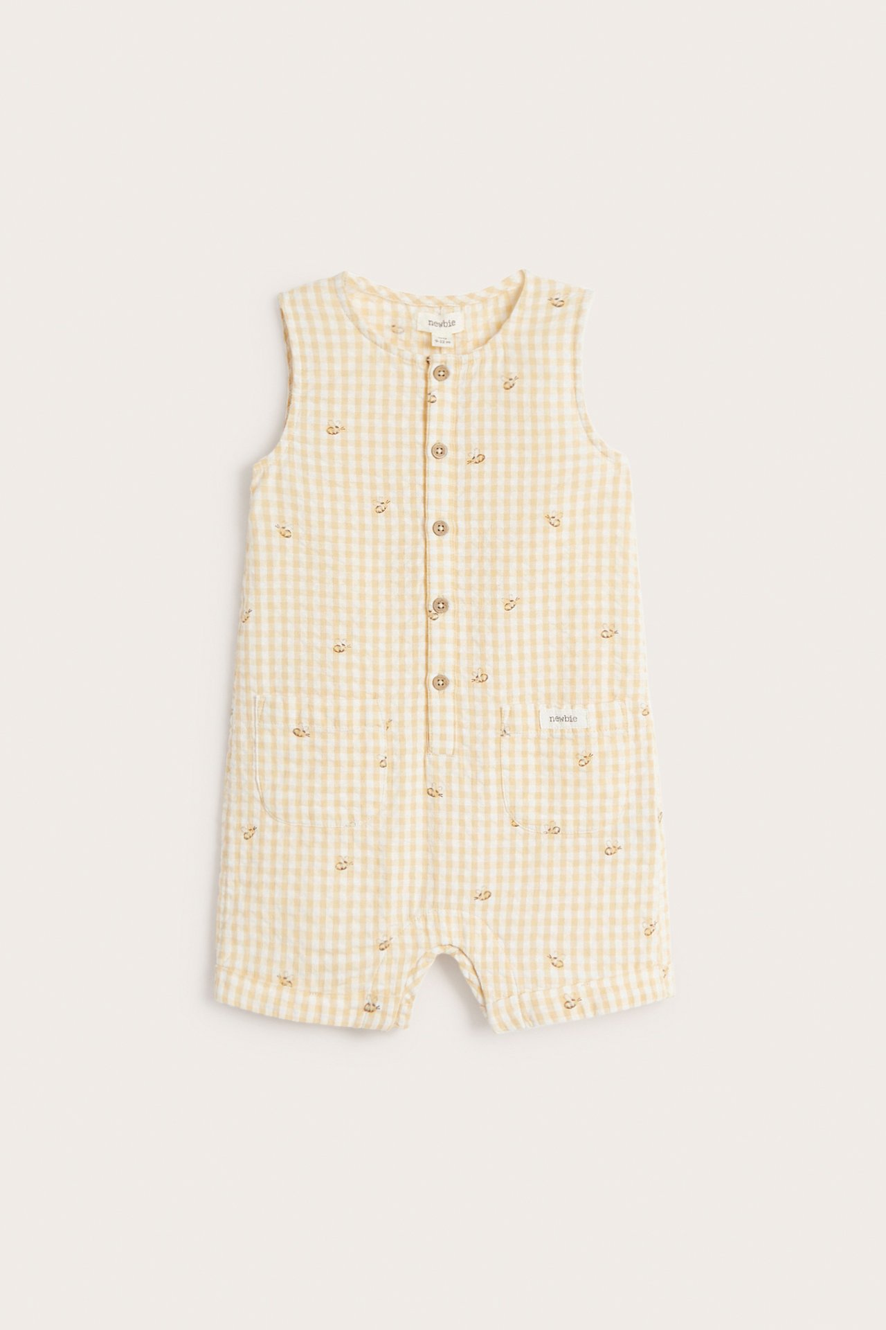 Front view of a baby's yellow gingham seersucker playsuit with embroidered animals, front buttons, and patch pockets.