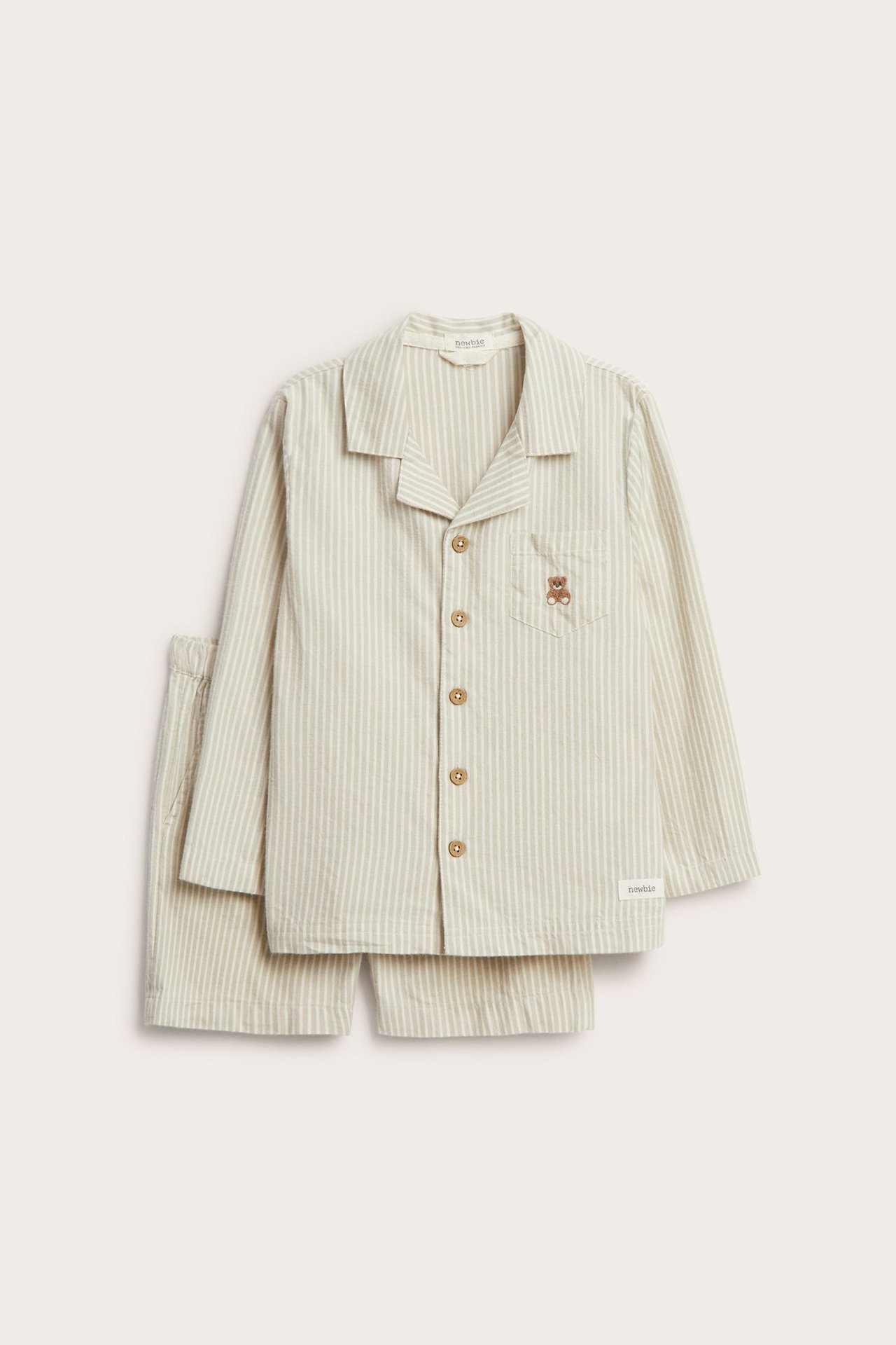 Front view of a kid's light green striped cotton pajama set: shirt with teddy bear and shorts.