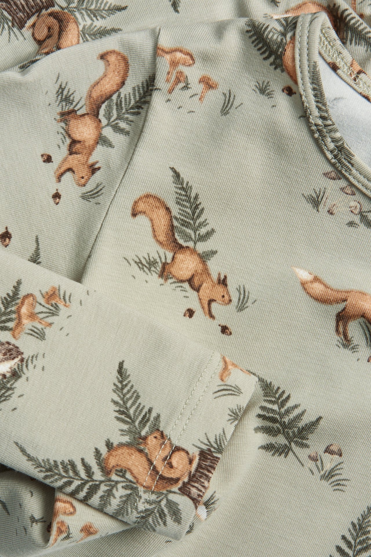 Long sleeve bodysuit with forest motif