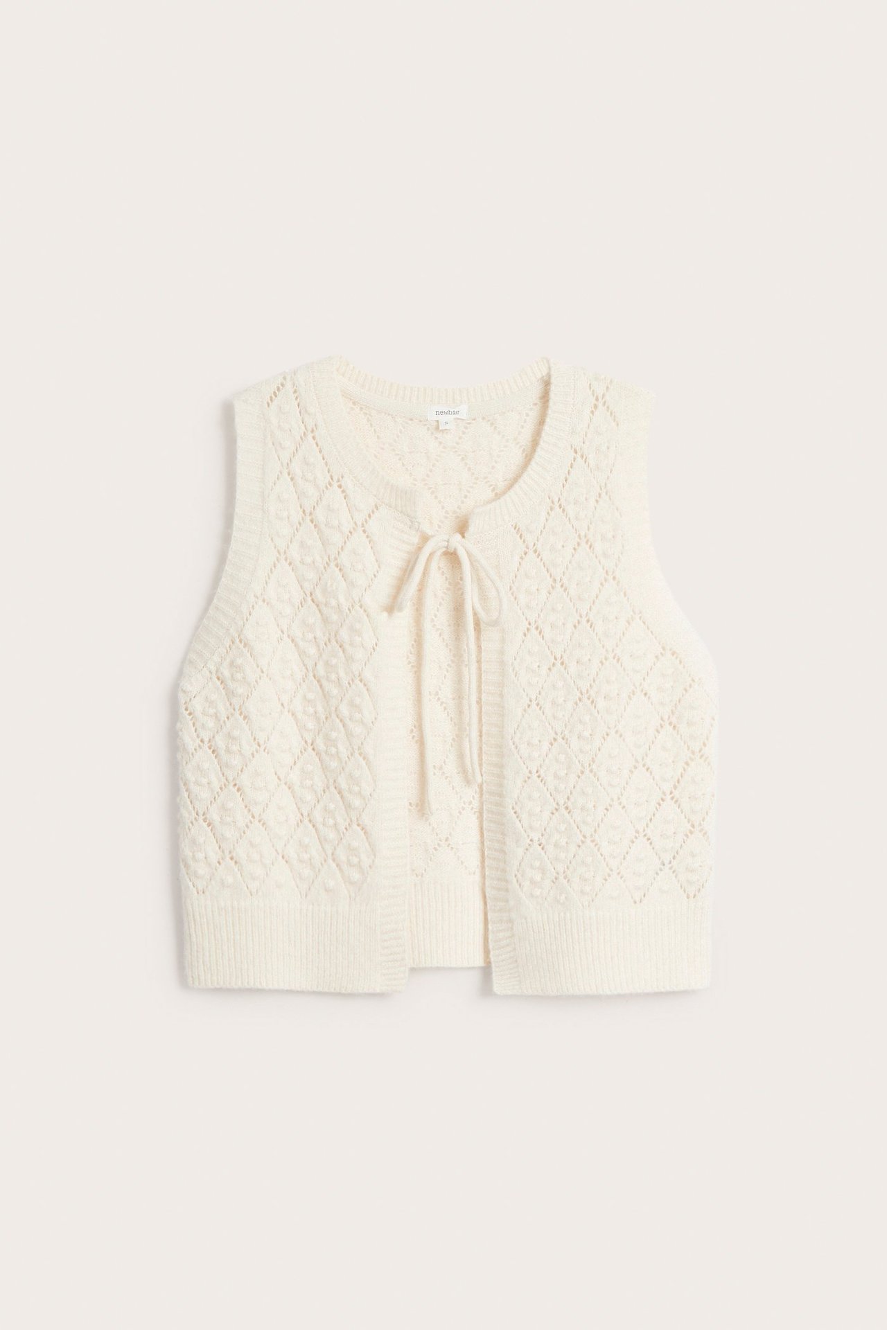 Front view of a beige melange wool blend knitted vest with diamond pattern and tie-front closure.