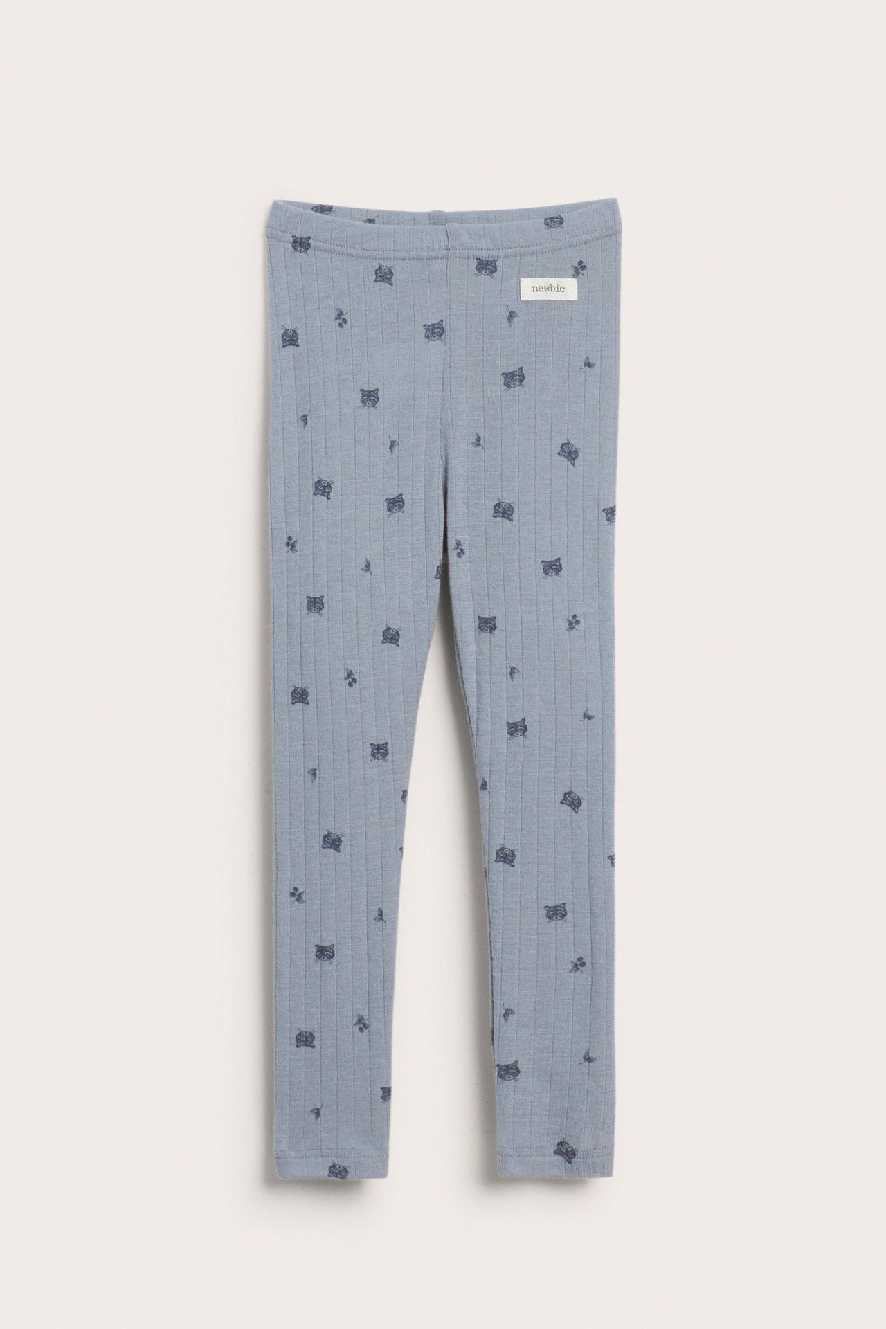 Vorderansicht hellblauer gerippter Merinowoll-Kinderleggings mit dunkelblauem Tiermuster.
