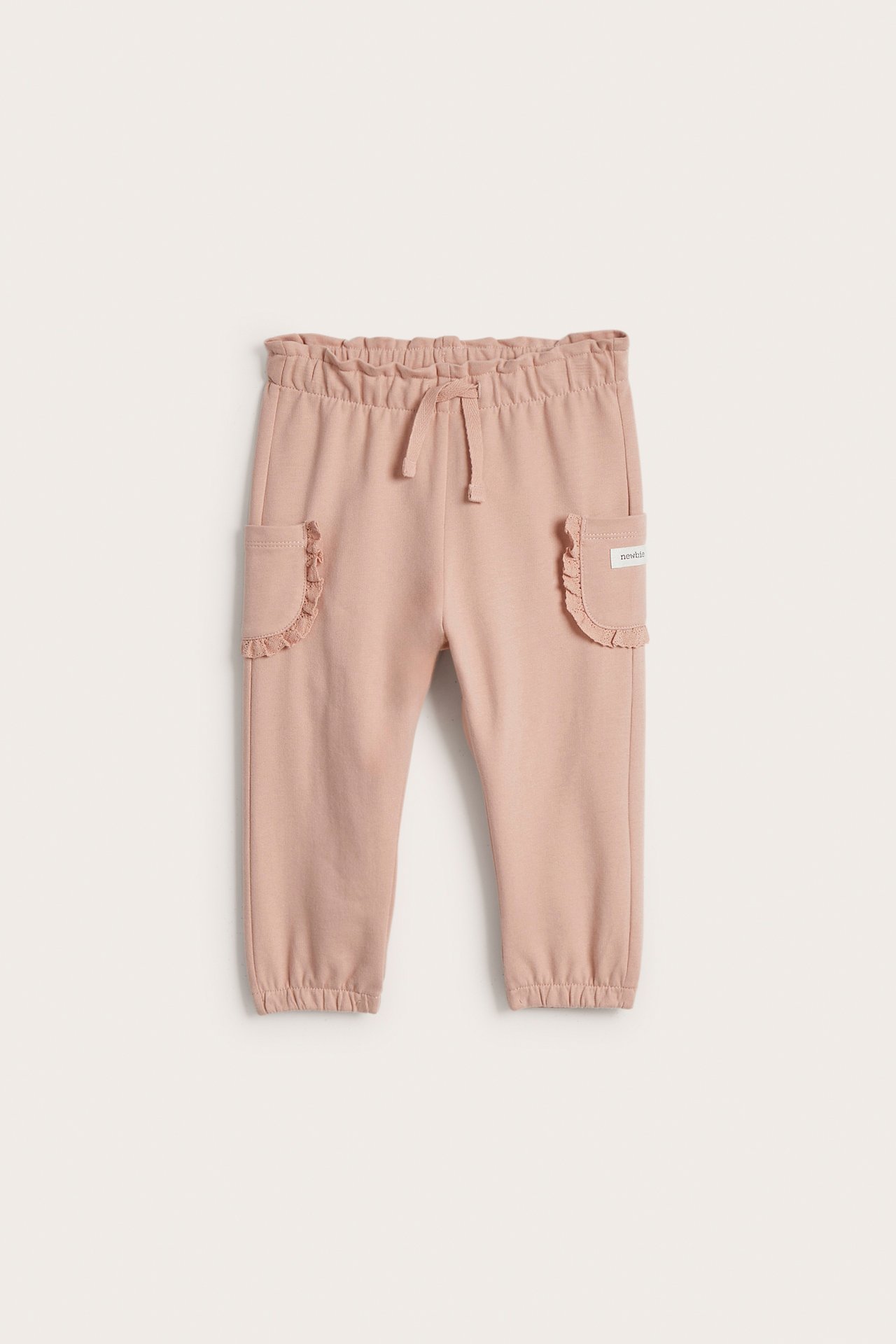Trousers with lace pockets
