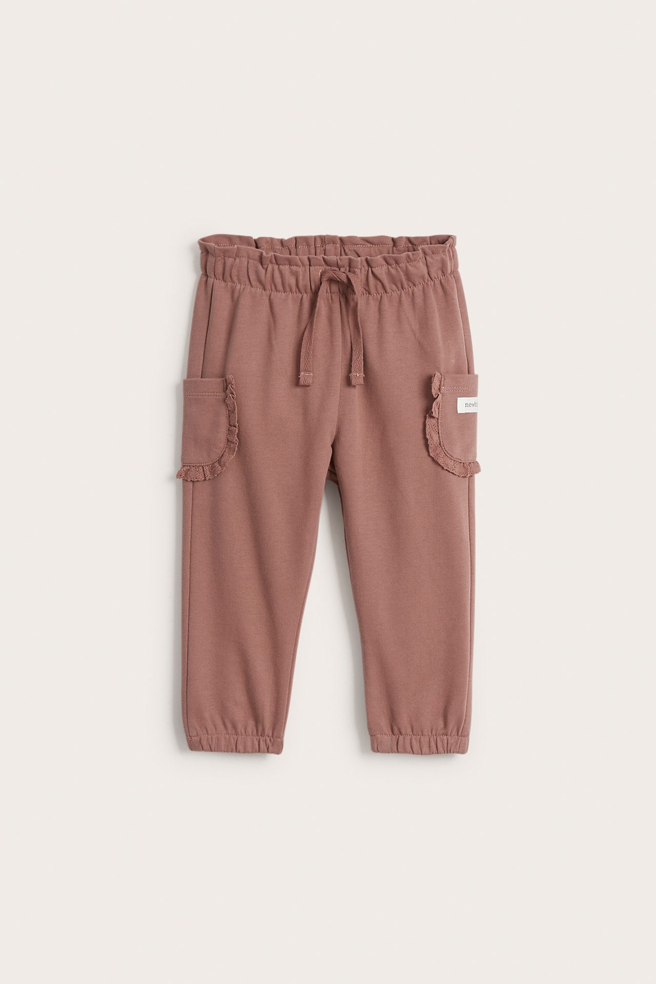 Trousers with lace pockets