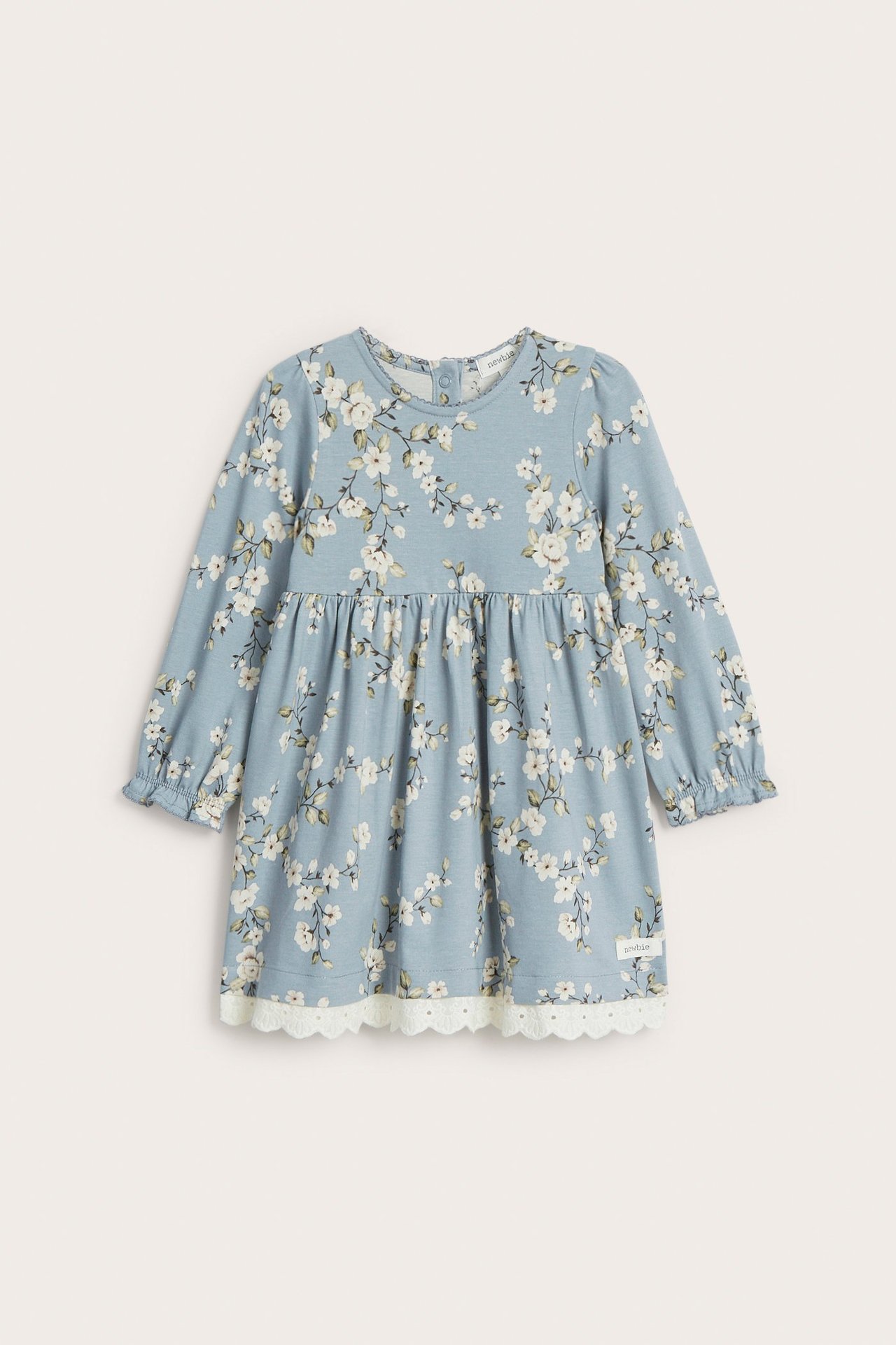 Vorderansicht: Baby-Jerseykleid in Hellblau mit Blumenmuster, Puffärmeln, Picot-Besatz und Spitzenborte.