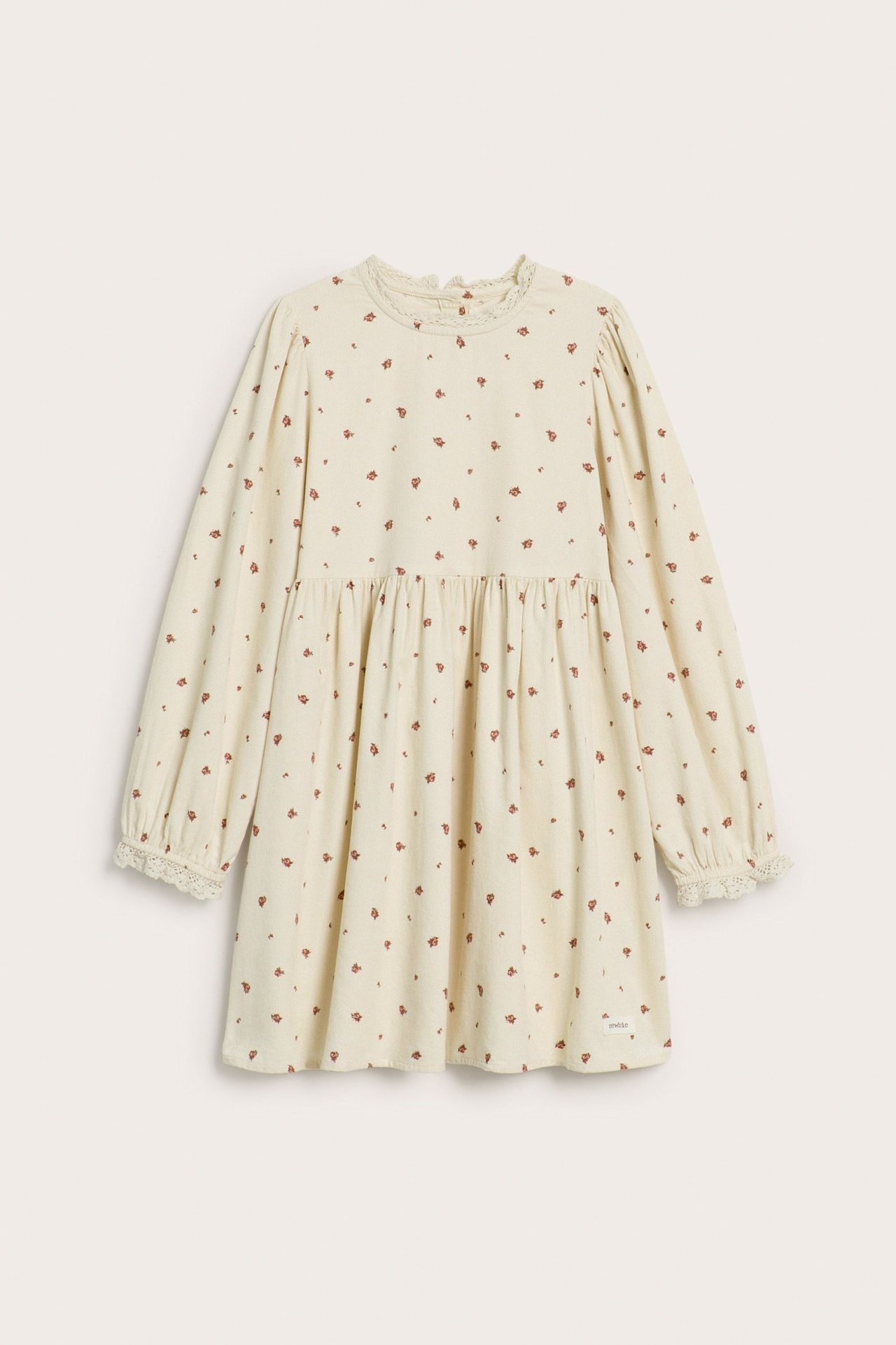 Front view of a kid's light beige corduroy dress with small red floral print, lace trim, and puff sleeves.
