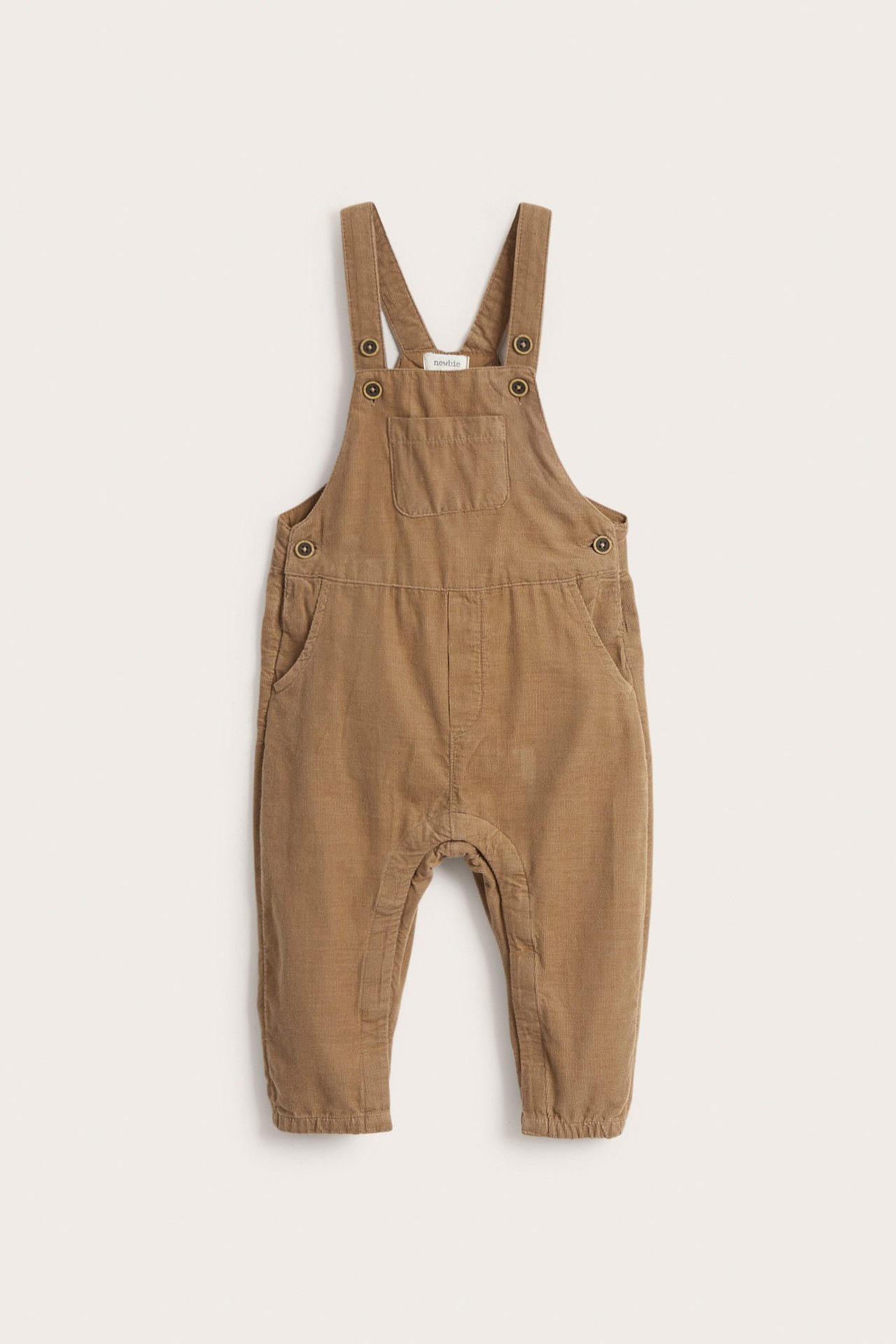 Brown woven manchester overalls for kids with adjustable straps, chest pocket, and side pockets.