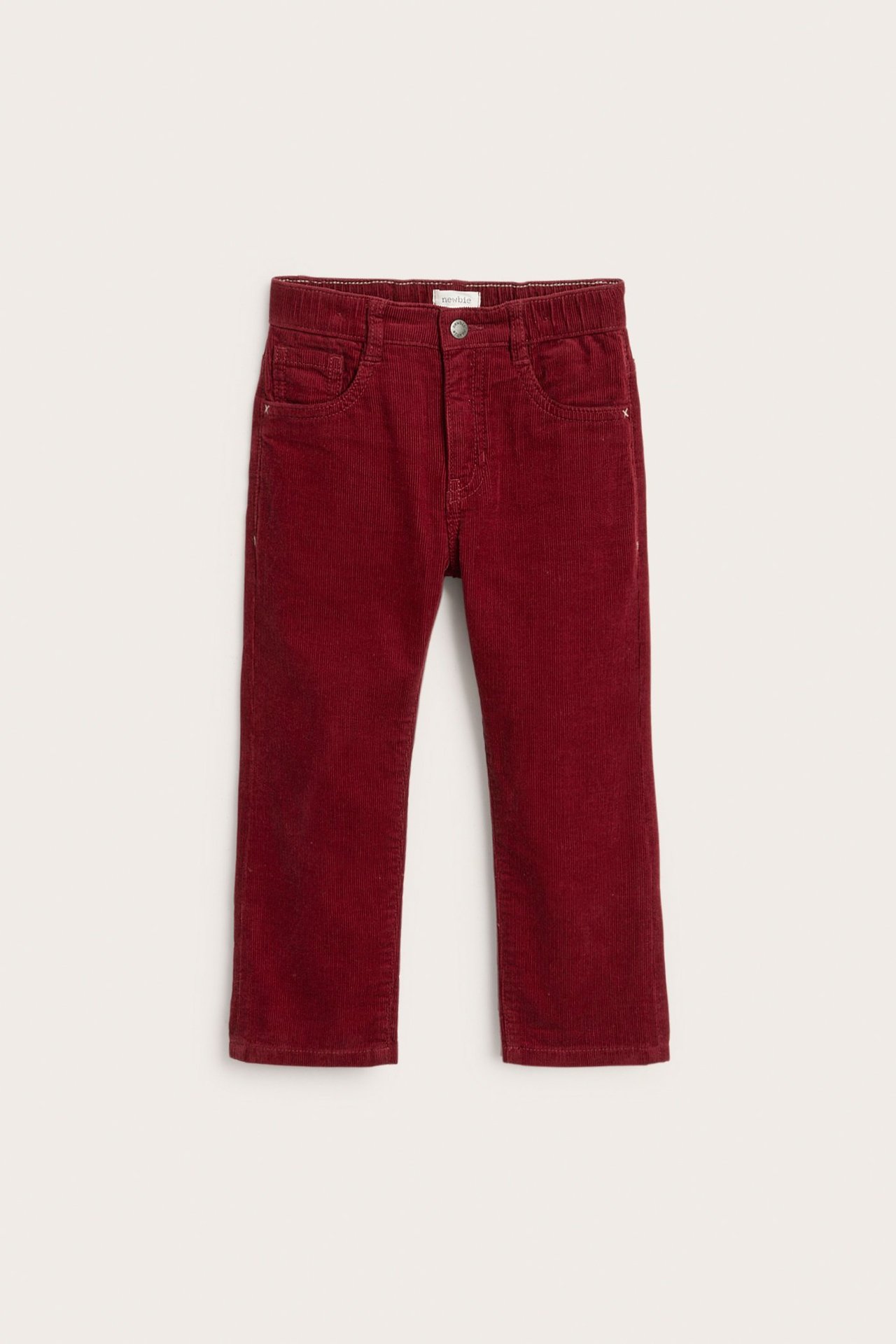Front view of kid's red corduroy pants with 5 pockets, button, fly, and elastic waist.