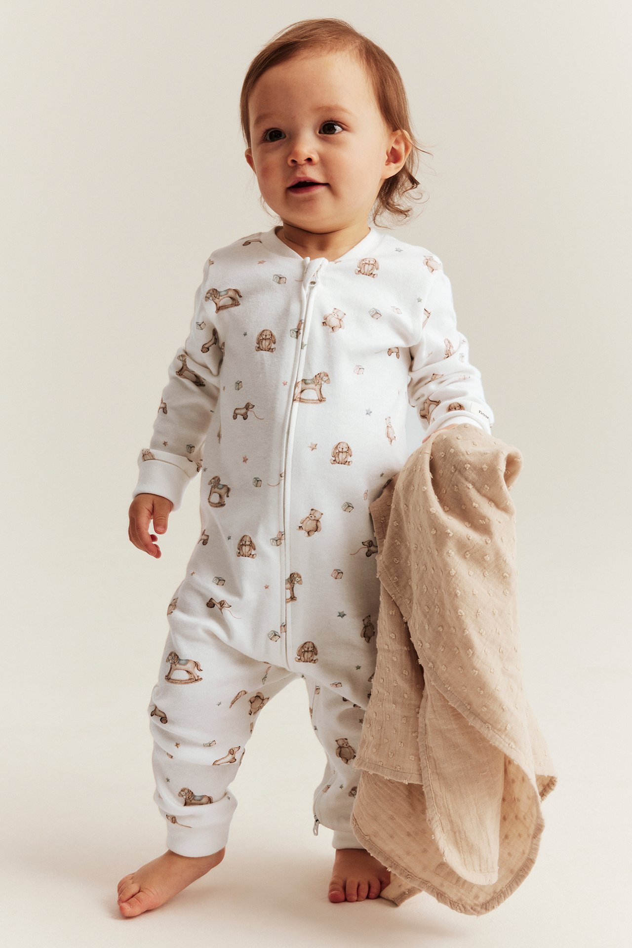 Baby pajamas with toy print