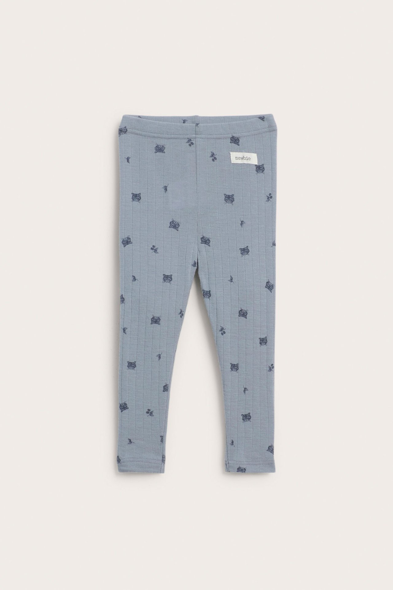 Vorderansicht von Baby-Leggings aus hellblauer gerippter Merinowolle mit dunklem Tiermuster.