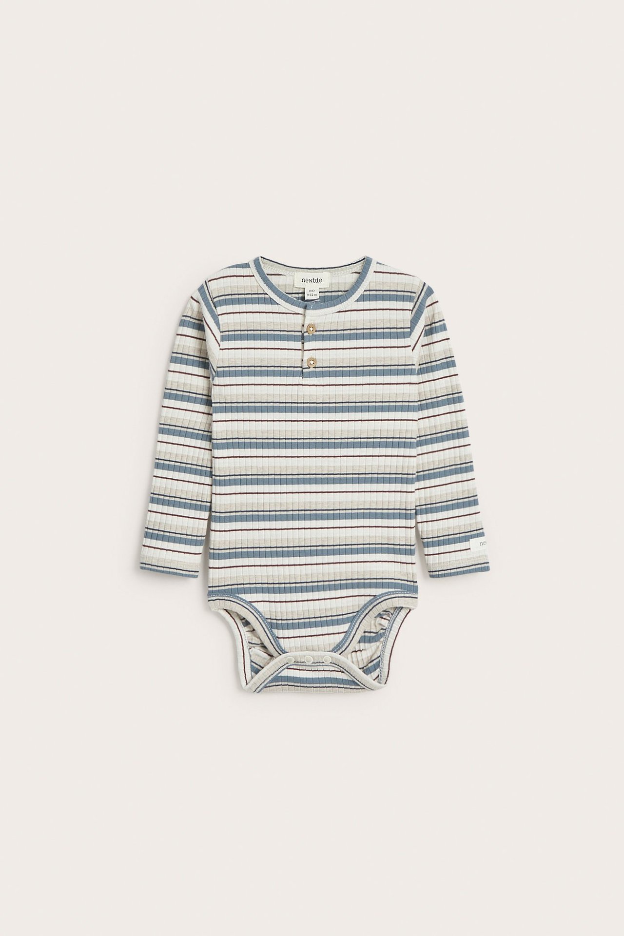 Front view of a baby's ribbed, striped long-sleeved blue, white, and brown cotton bodysuit with front buttons.