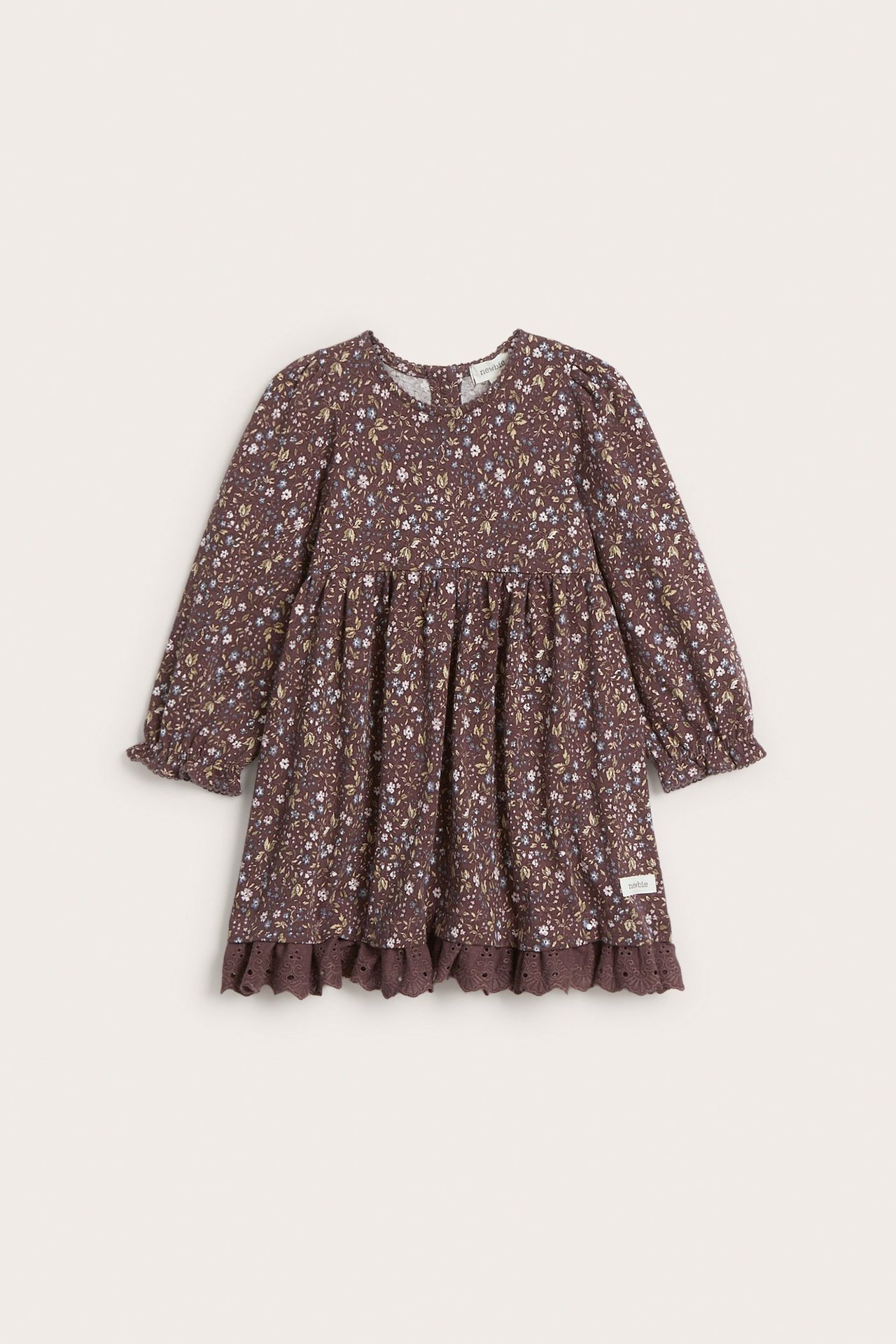 Vorderansicht: Dunkellila geblümtes Jerseykleid für Kinder mit Puffärmeln und Spitzenbesatz am Saum.