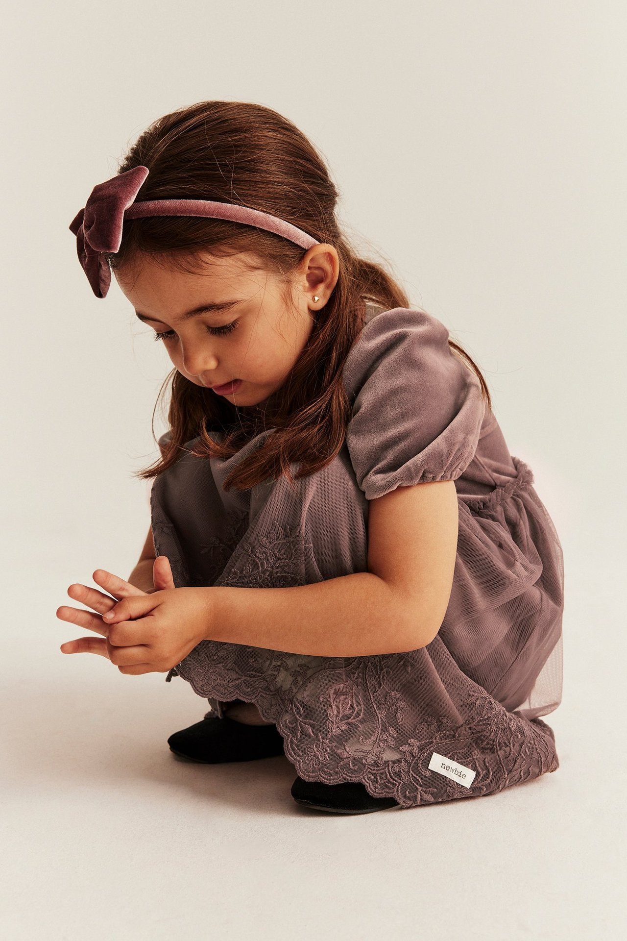 Dark pink velour dress with mesh skirt, embroidery details, for girl, front view.