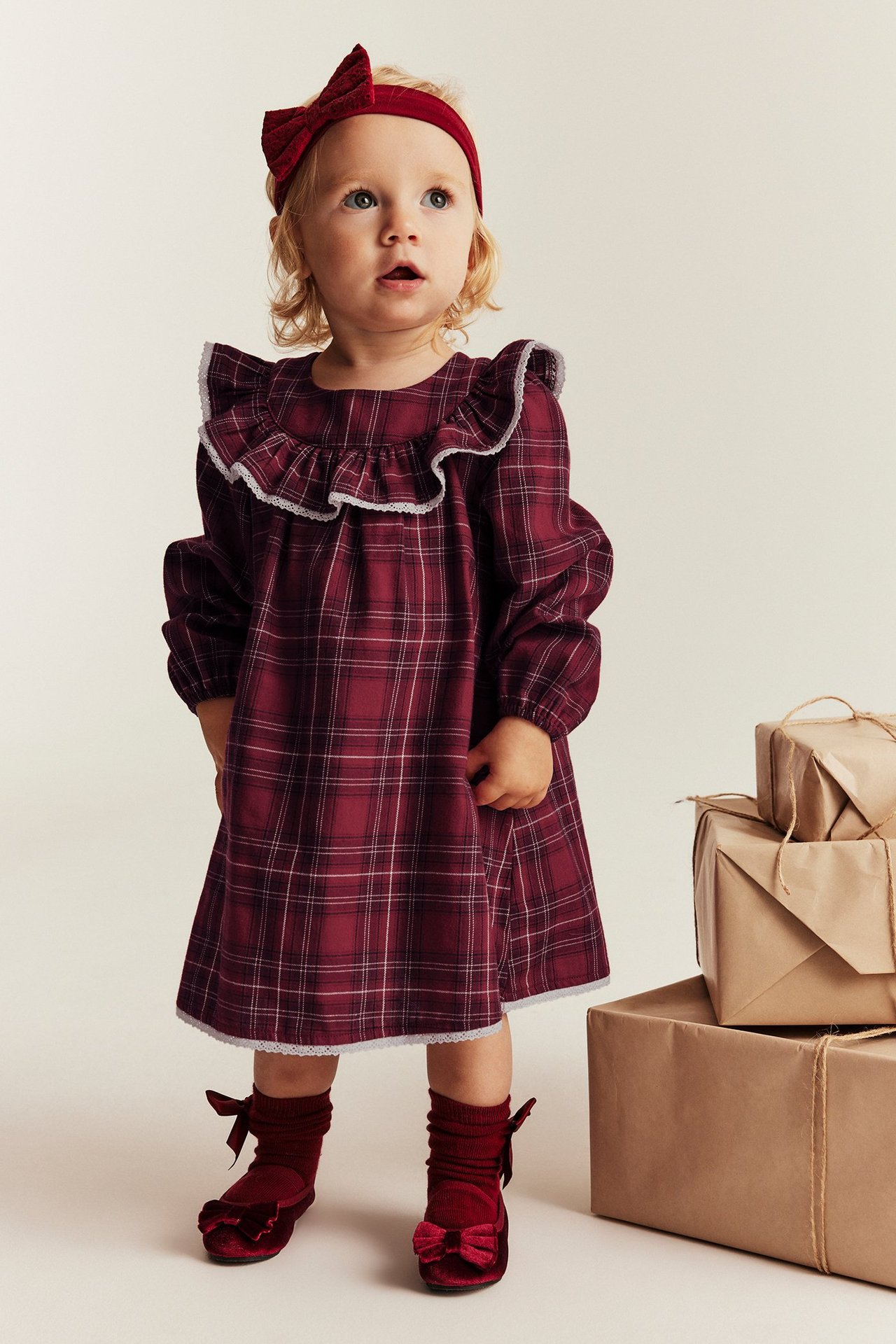 Red checkered Christmas dress for kid with ruffle neckline, lace edges, back buttons.