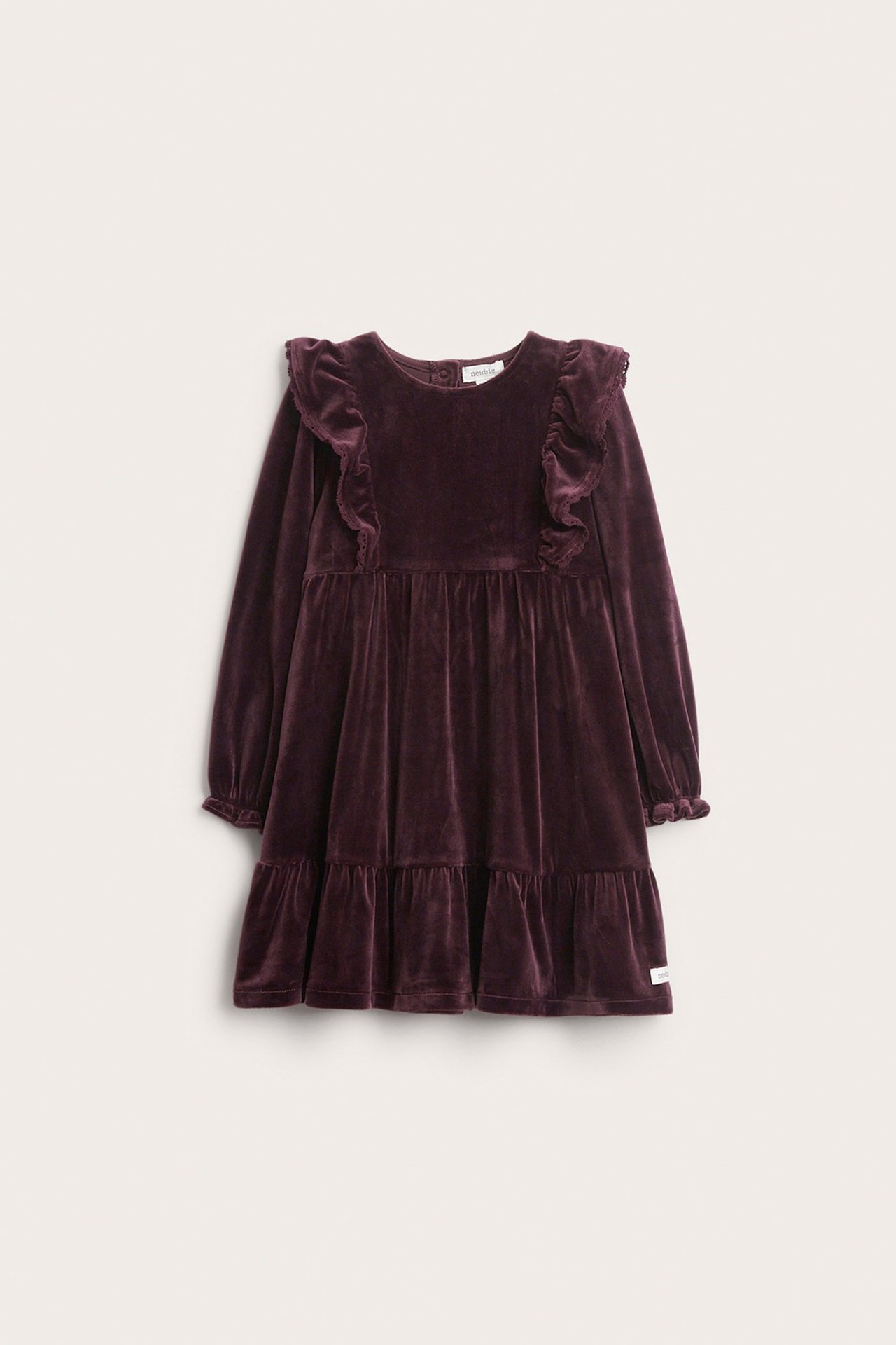 Front view of a kid's plum velour dress with lace-edged shoulder ruffles, long sleeves, and a tiered skirt.