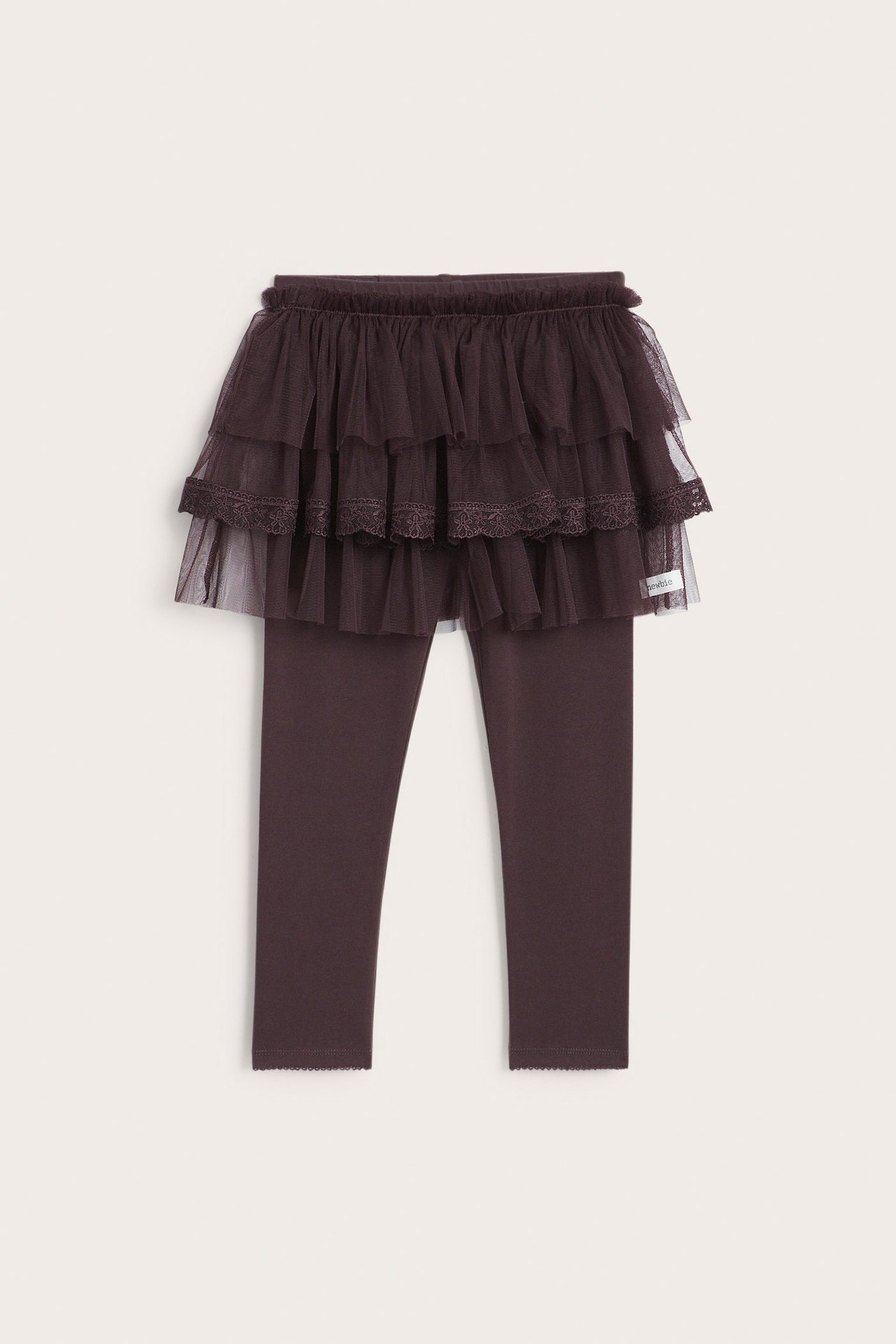 Front view of kid's dark plum leggings with an attached three-tiered tulle skirt, lace on middle tier.