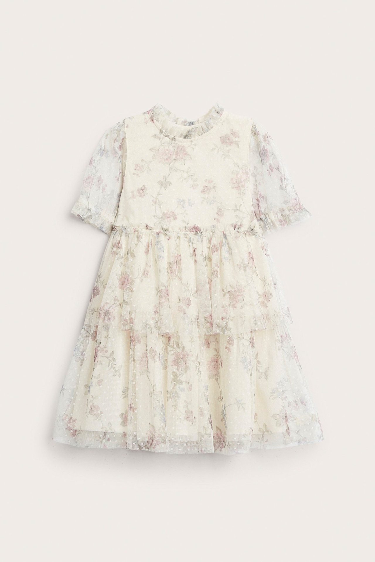 Front view of a kid's light beige floral mesh dress with tiered skirt, puff sleeves, and ruffled collar.