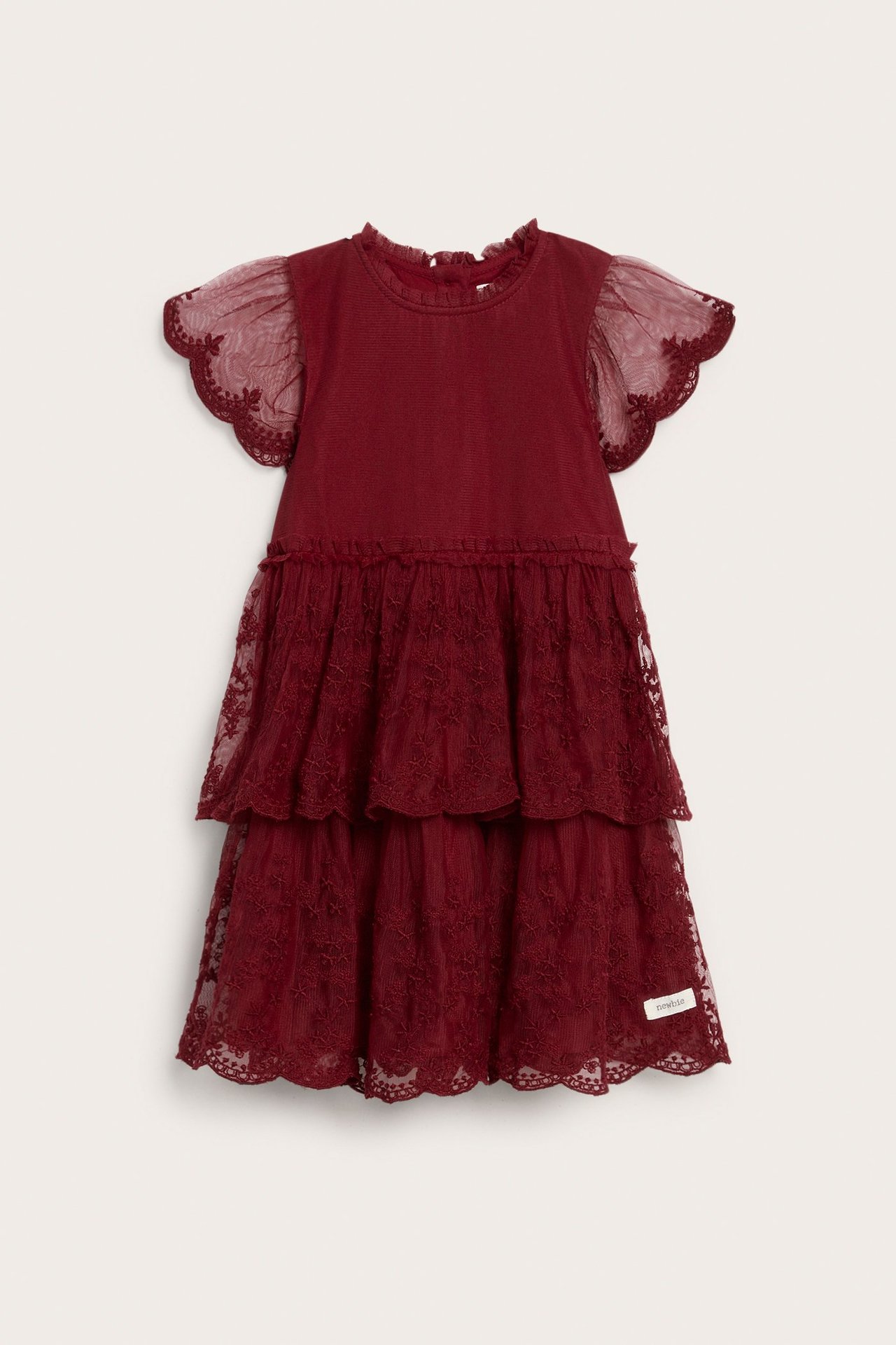 Front view of a red kid's dress with a ruffled collar, mesh butterfly sleeves, and tiered embroidered mesh skirt.