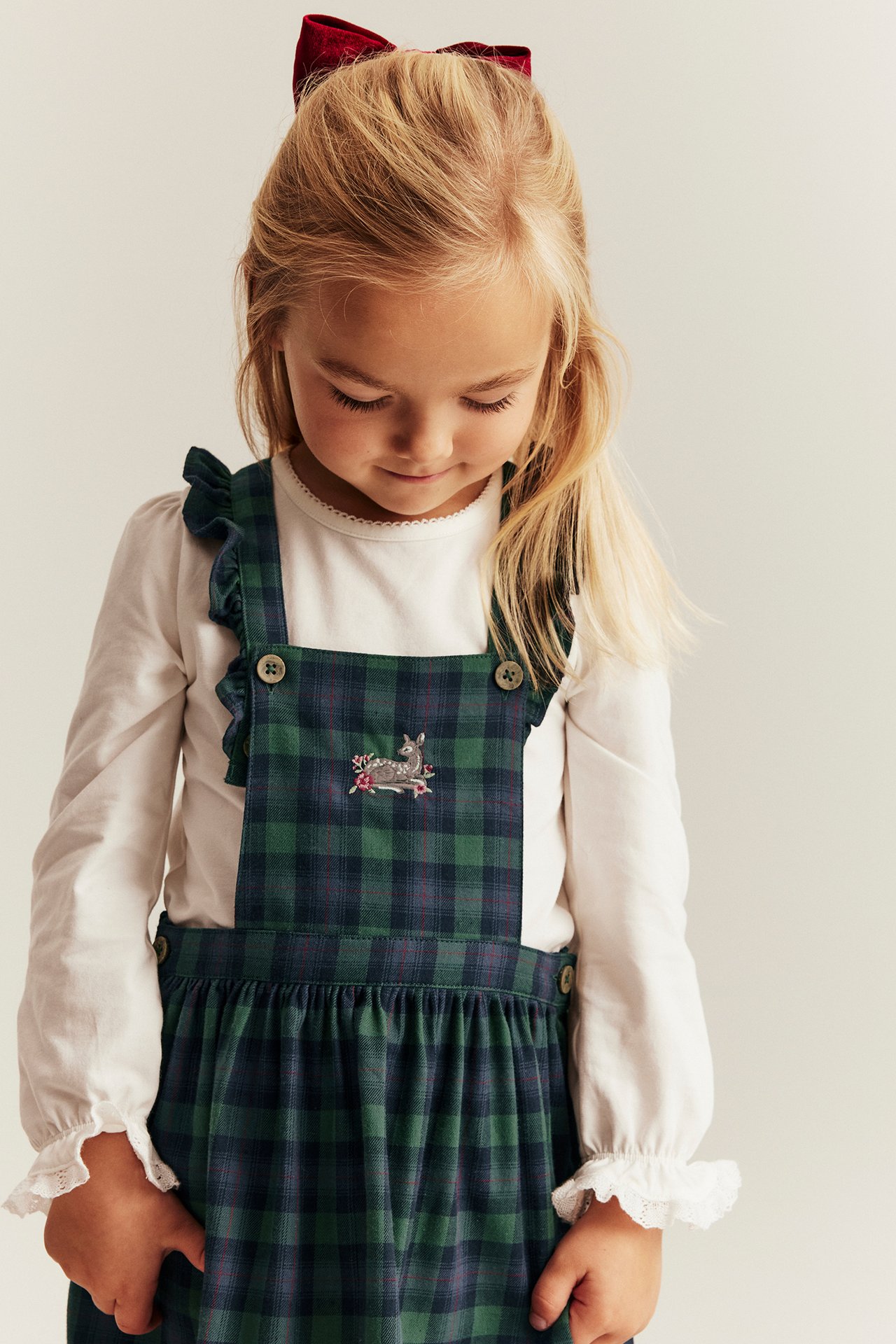 Blue plaid suspender dress for kid with embroidery, adjustable straps, side buttons.