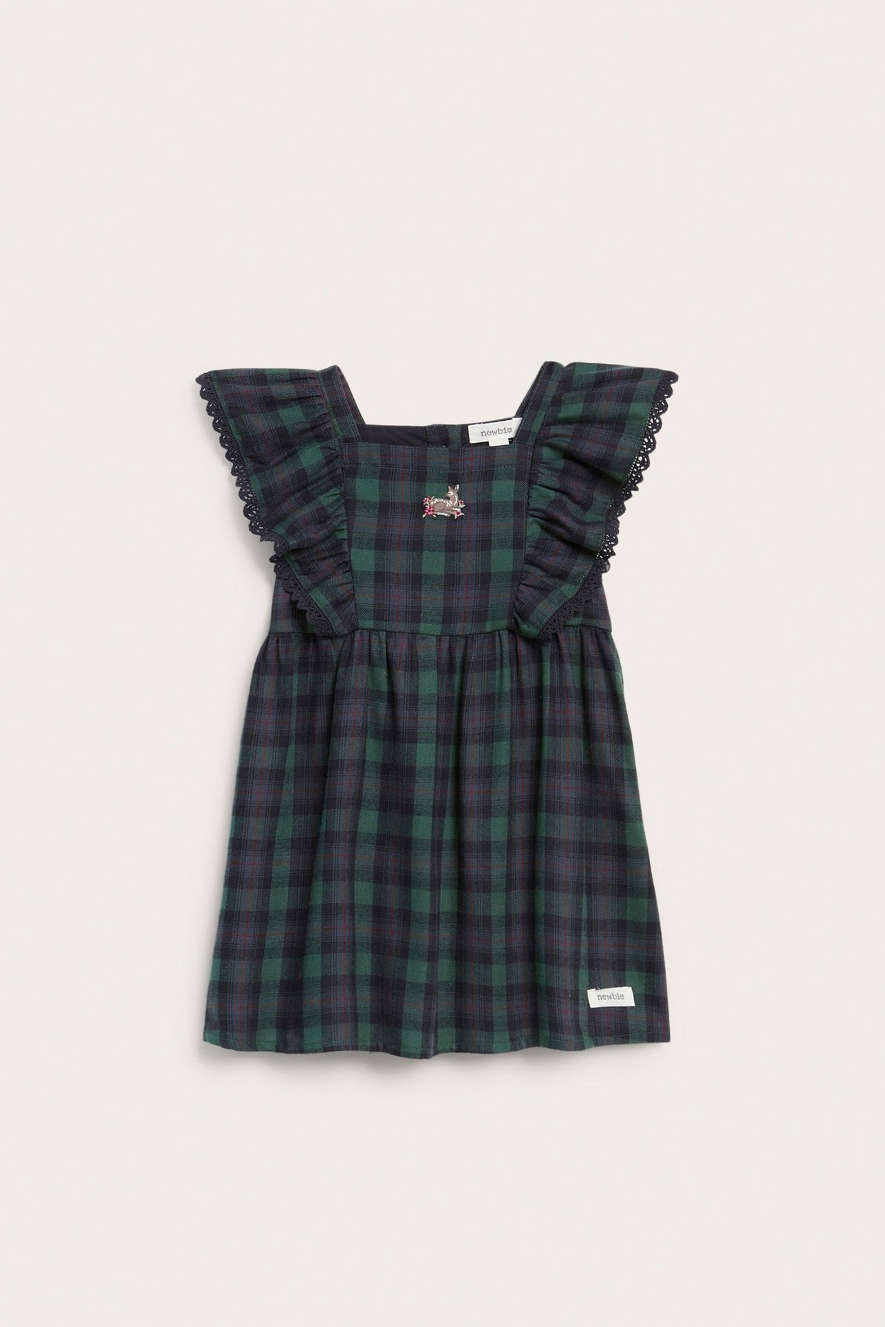 Kid's blue and green plaid pinafore dress with bunny embroidery and lace-trimmed ruffles.