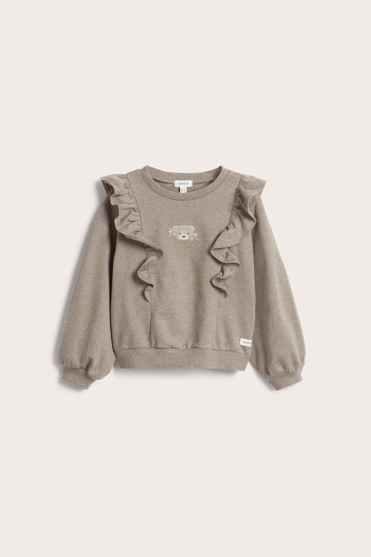 Front view of a kid's brown melange cotton sweatshirt with shoulder ruffles and a bear embroidery.