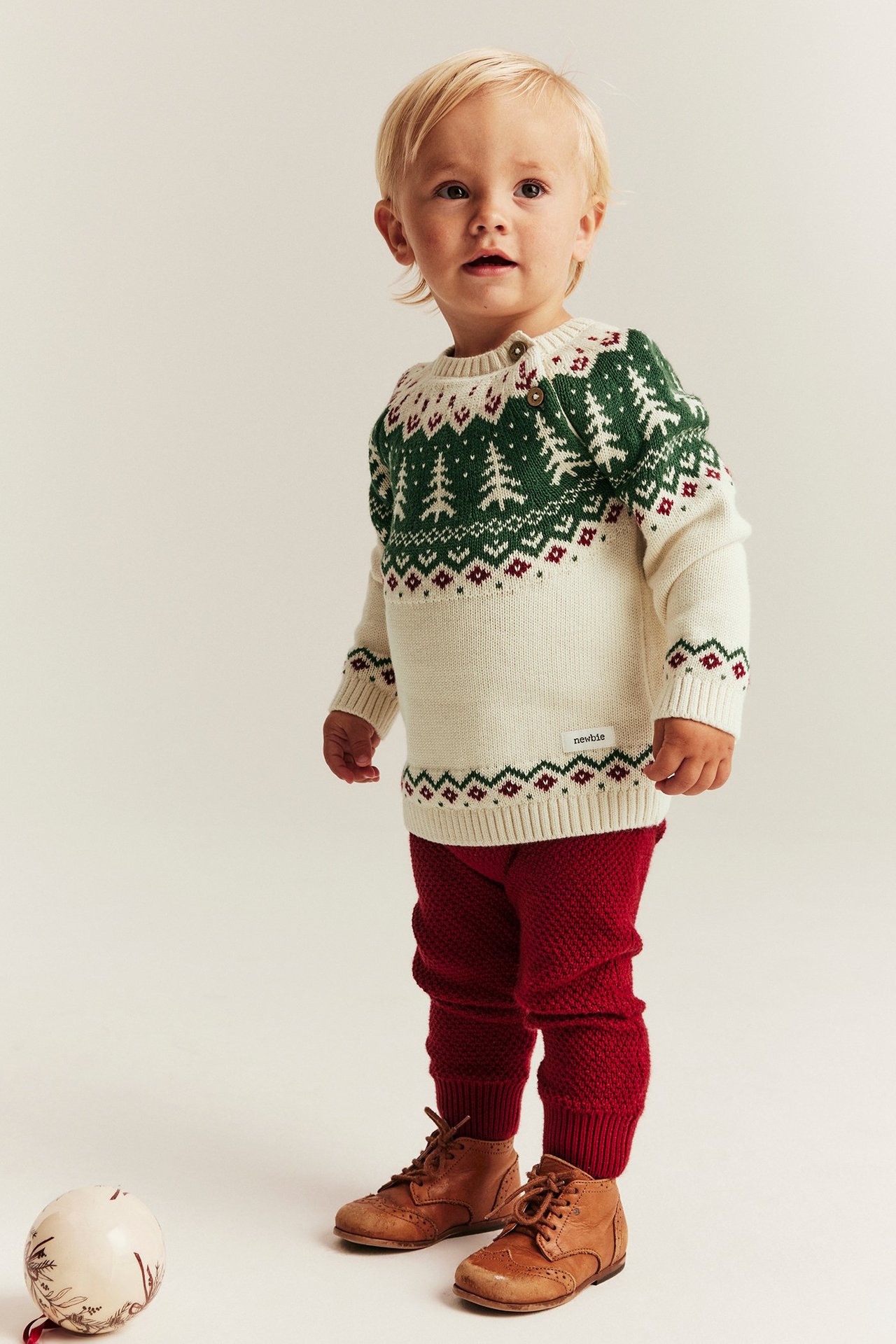 Knitted Christmas sweater with spruce trees