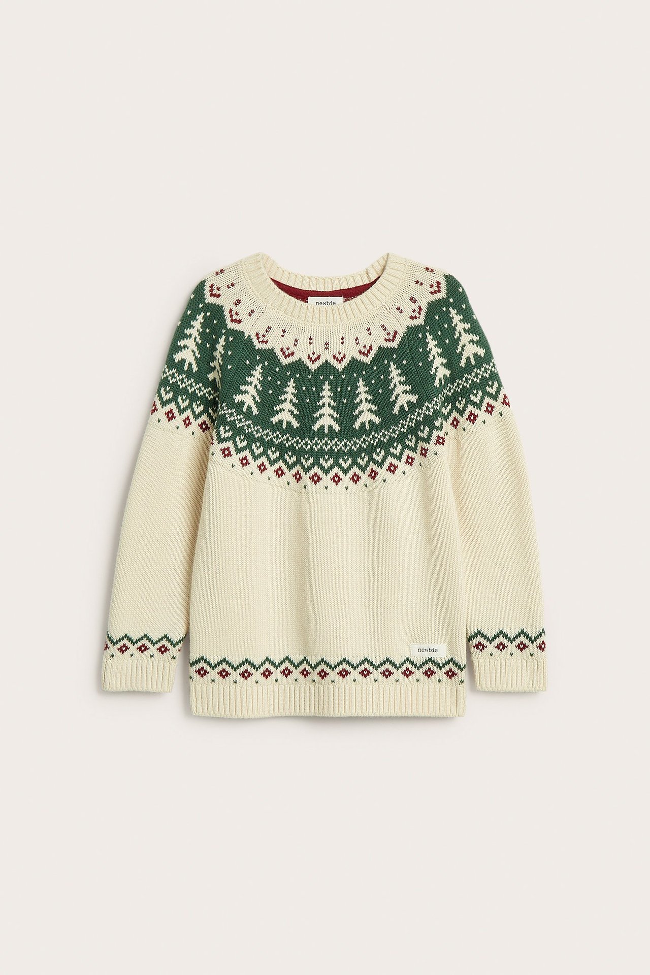 Front view of an offwhite knitted cotton Christmas sweater with green fir trees and red jacquard pattern.