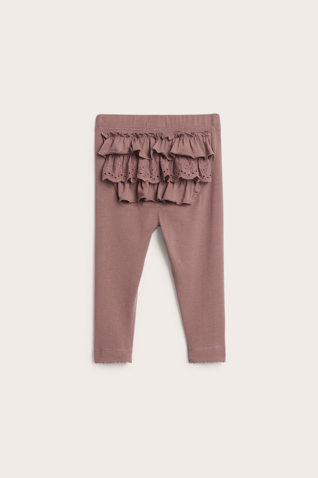 Front view of baby's dark pink cotton leggings with ruffles and lace detail on the back.