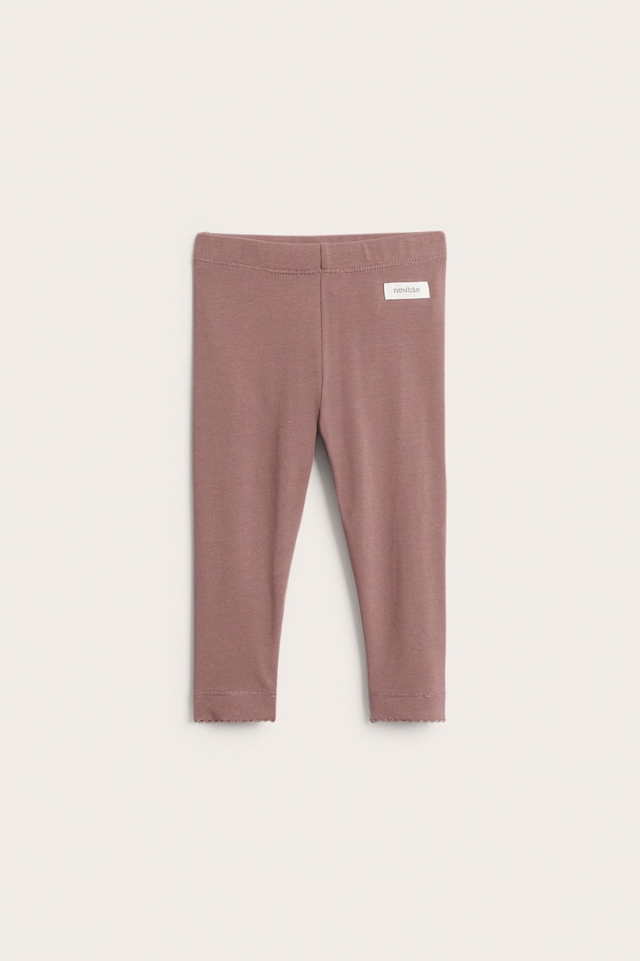 Vorderansicht dunkelrosafarbener Kinder-Leggings aus Baumwollmix mit Gummibund und gewelltem Saum.