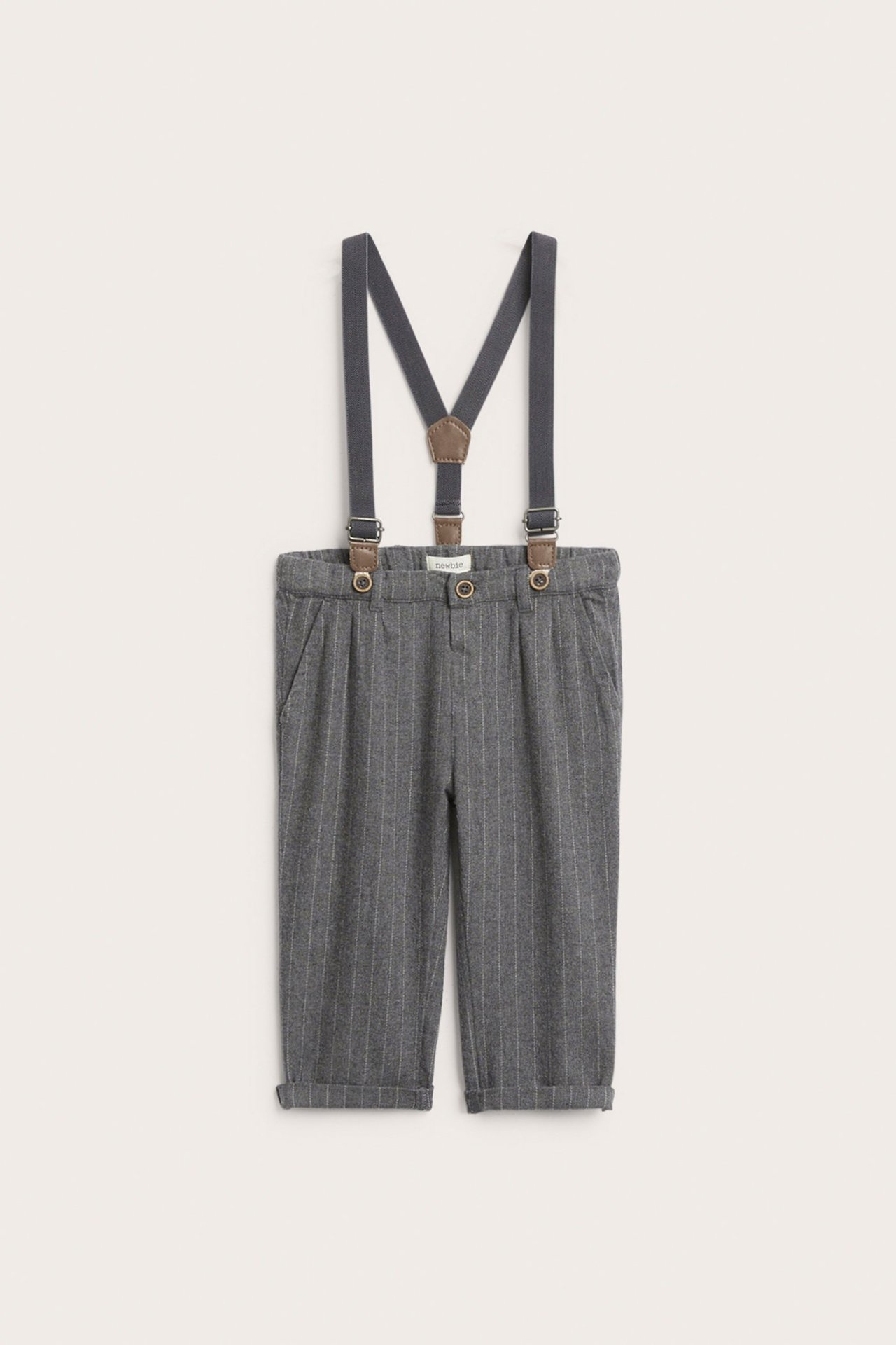 Front view of kid's grey melange pinstripe woven trousers with adjustable dark grey suspenders and faux leather details.