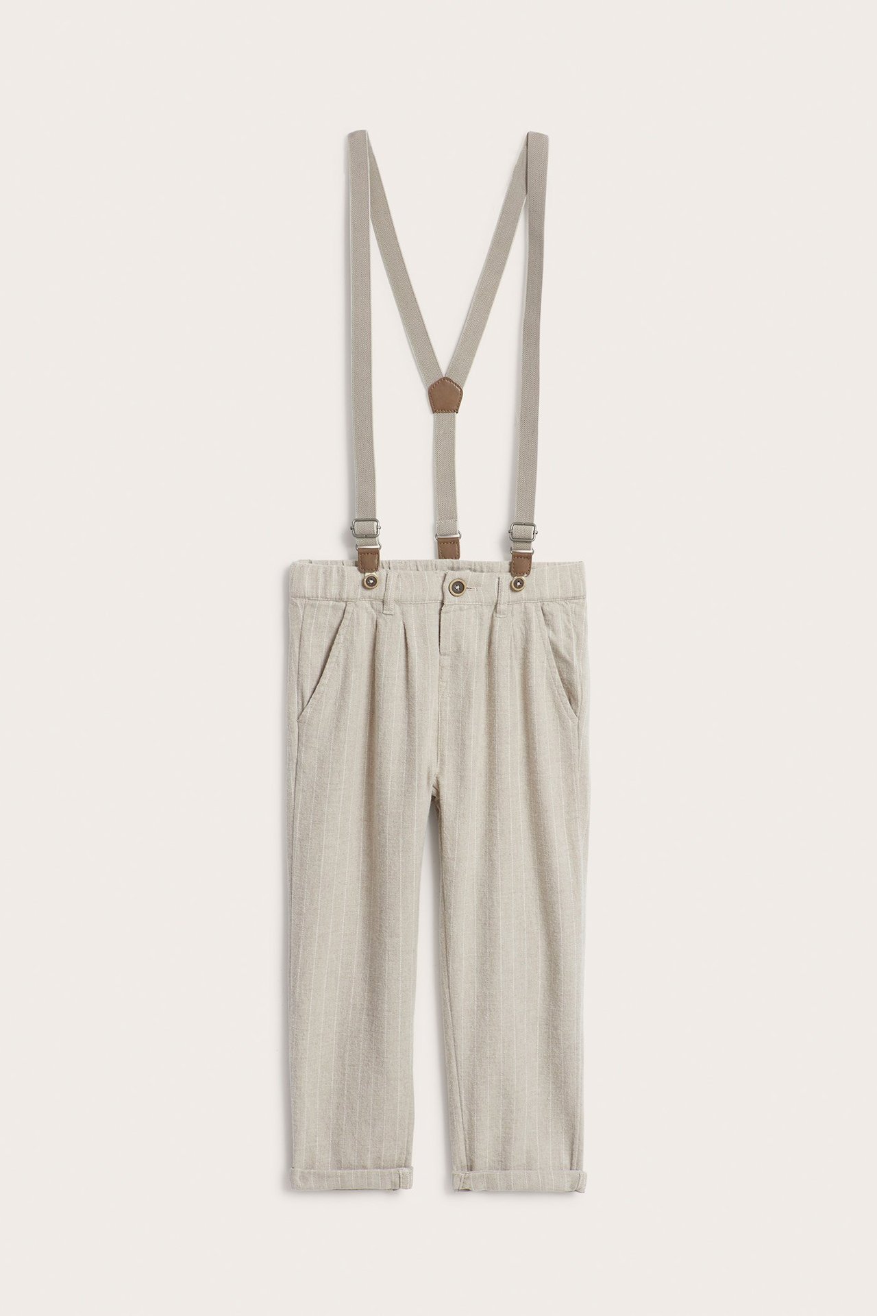 Front view of kid's light beige, fine striped cotton trousers with light beige adjustable suspenders.