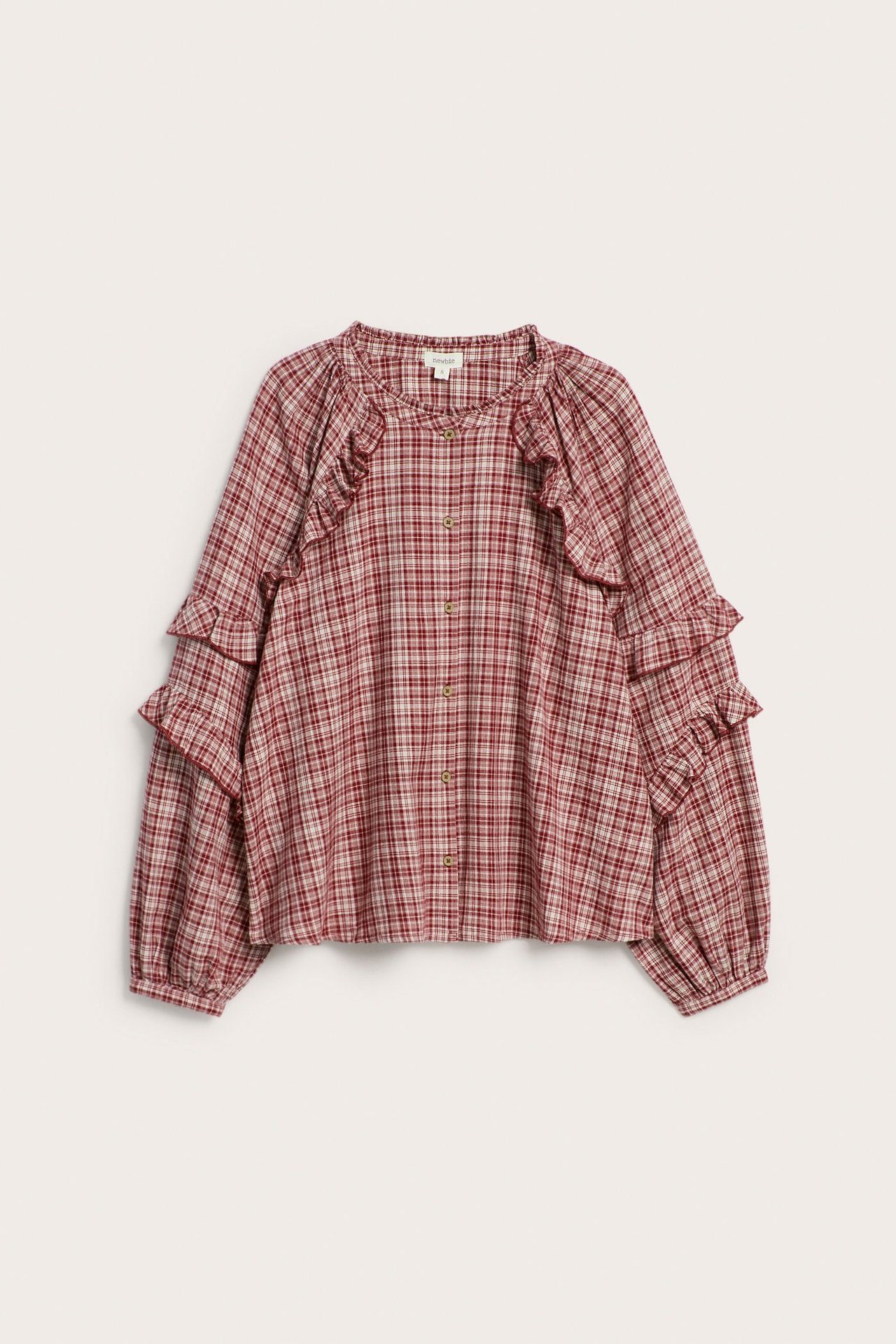 Front view: Woman's red plaid cotton blouse with ruffles on yoke and sleeves, button-front, relaxed fit.
