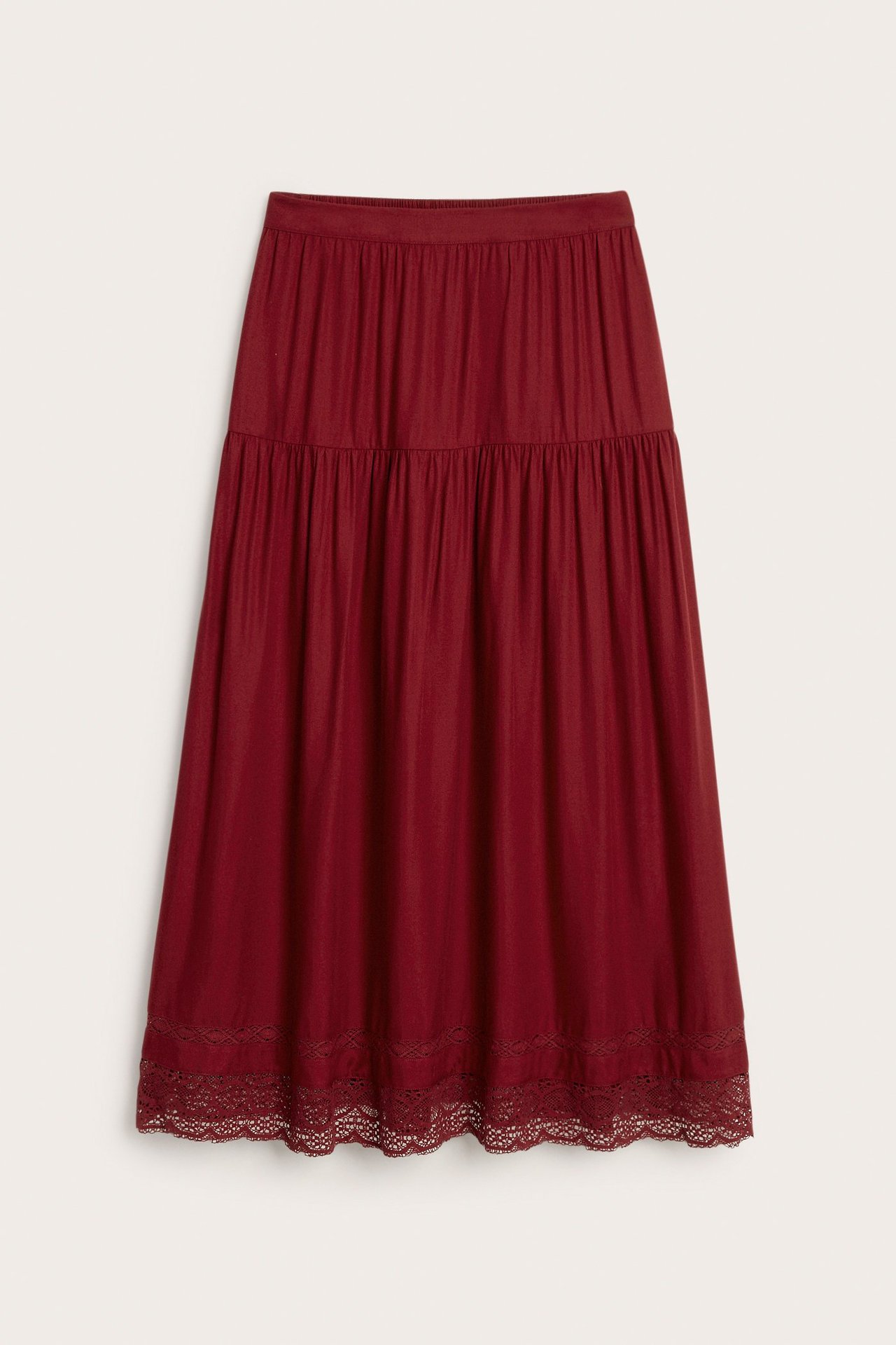 Front view of a dark red viscose midi skirt with elasticated waist and lace hem.