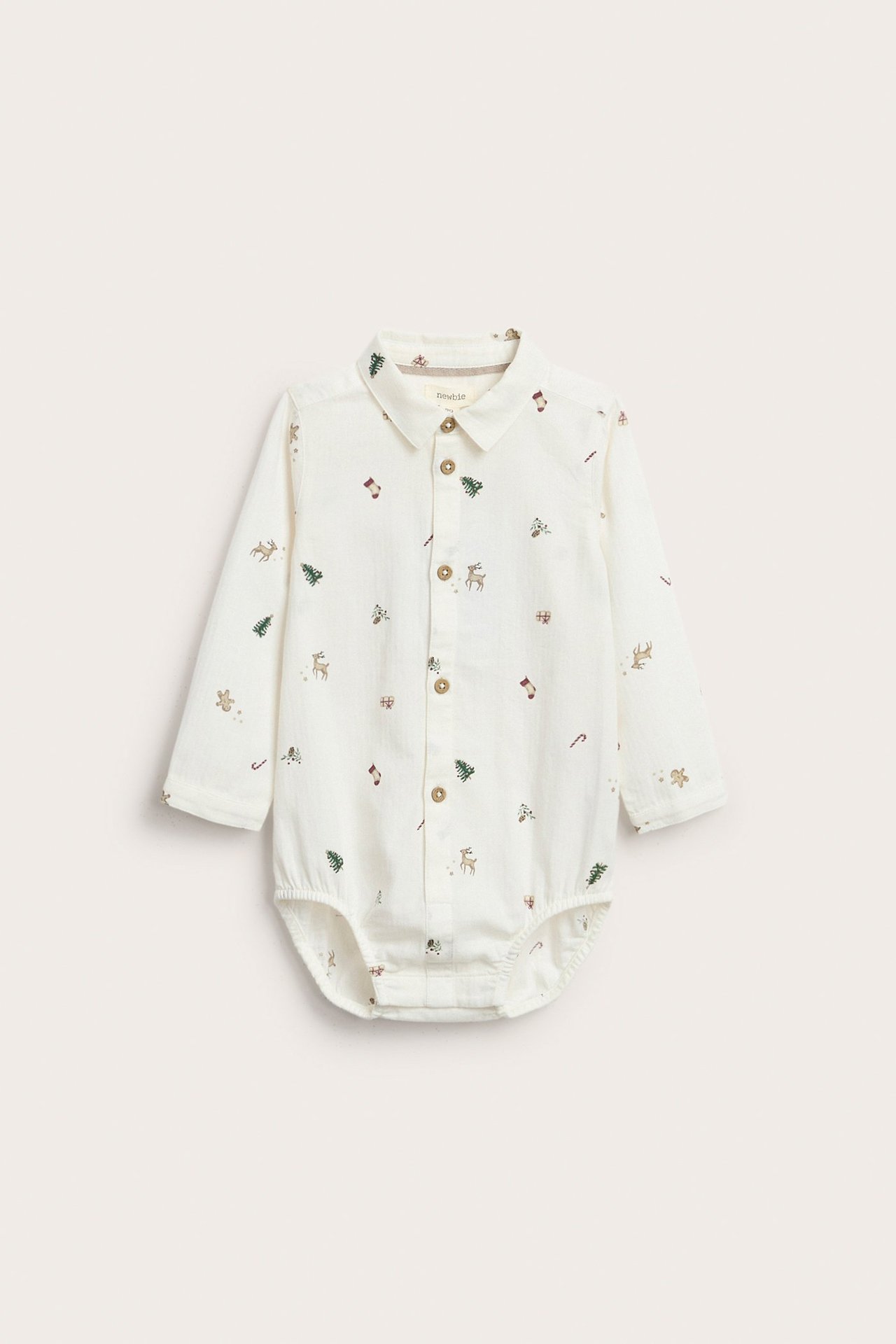 Offwhite Weihnachtsmotiv-Strampelbody aus Webstoff für Baby mit Knöpfen und Tiermuster.