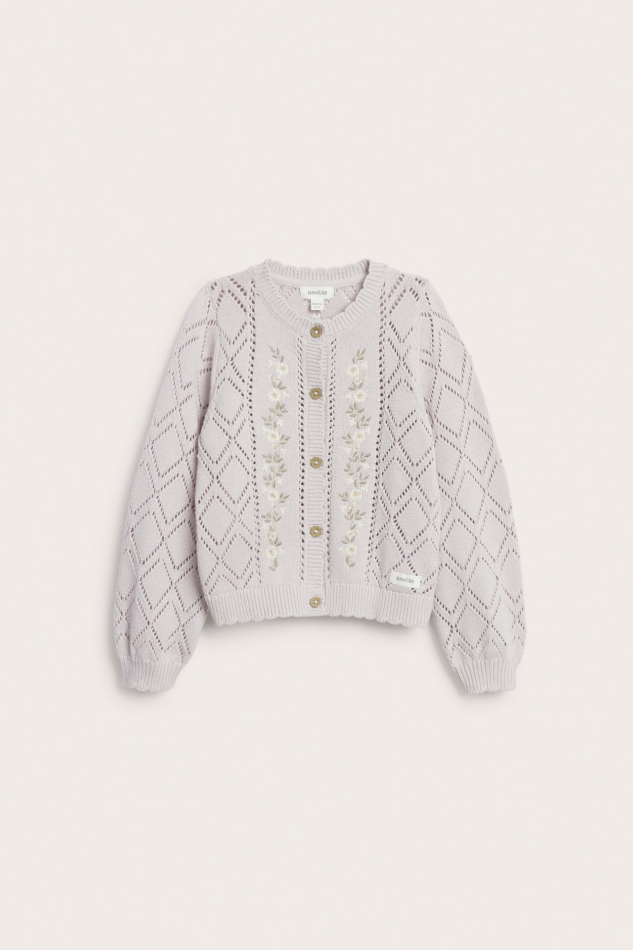 Front view of a kid's light lilac cotton pattern-knit cardigan with embroidered flowers and front buttons.