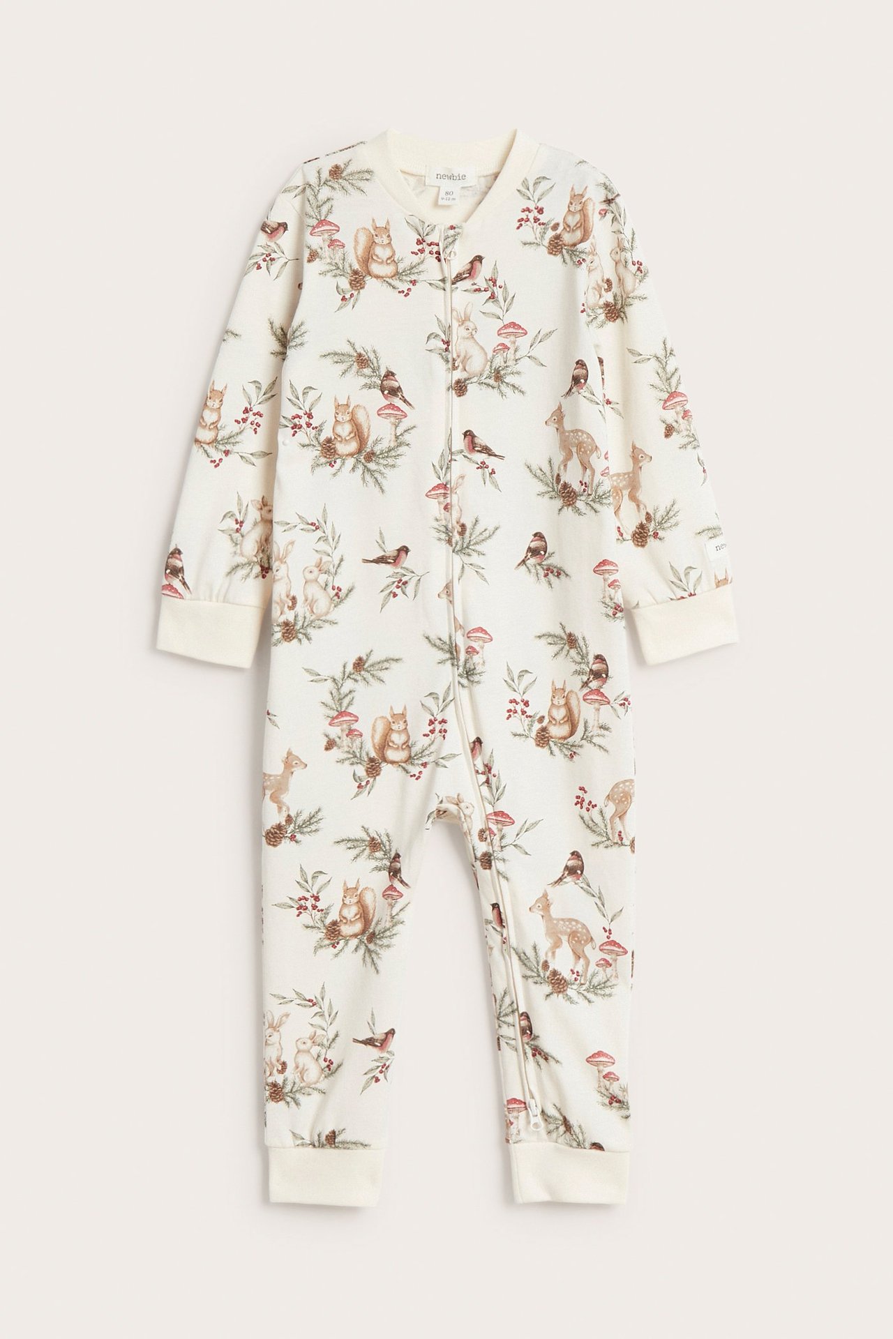 Front view of a baby offwhite sleepsuit with a Christmas animal pattern and a two-way zip.