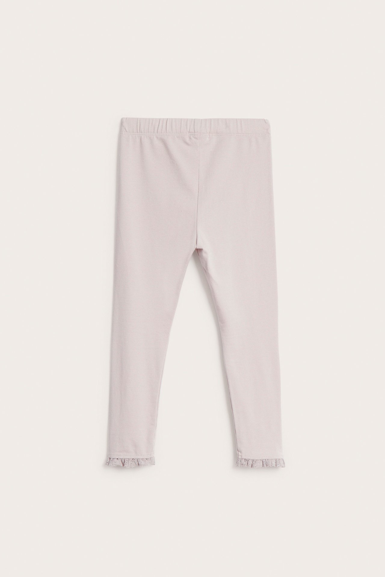 Front view of light purple kid's leggings with an elastic waist and ruffled ankle cuffs.