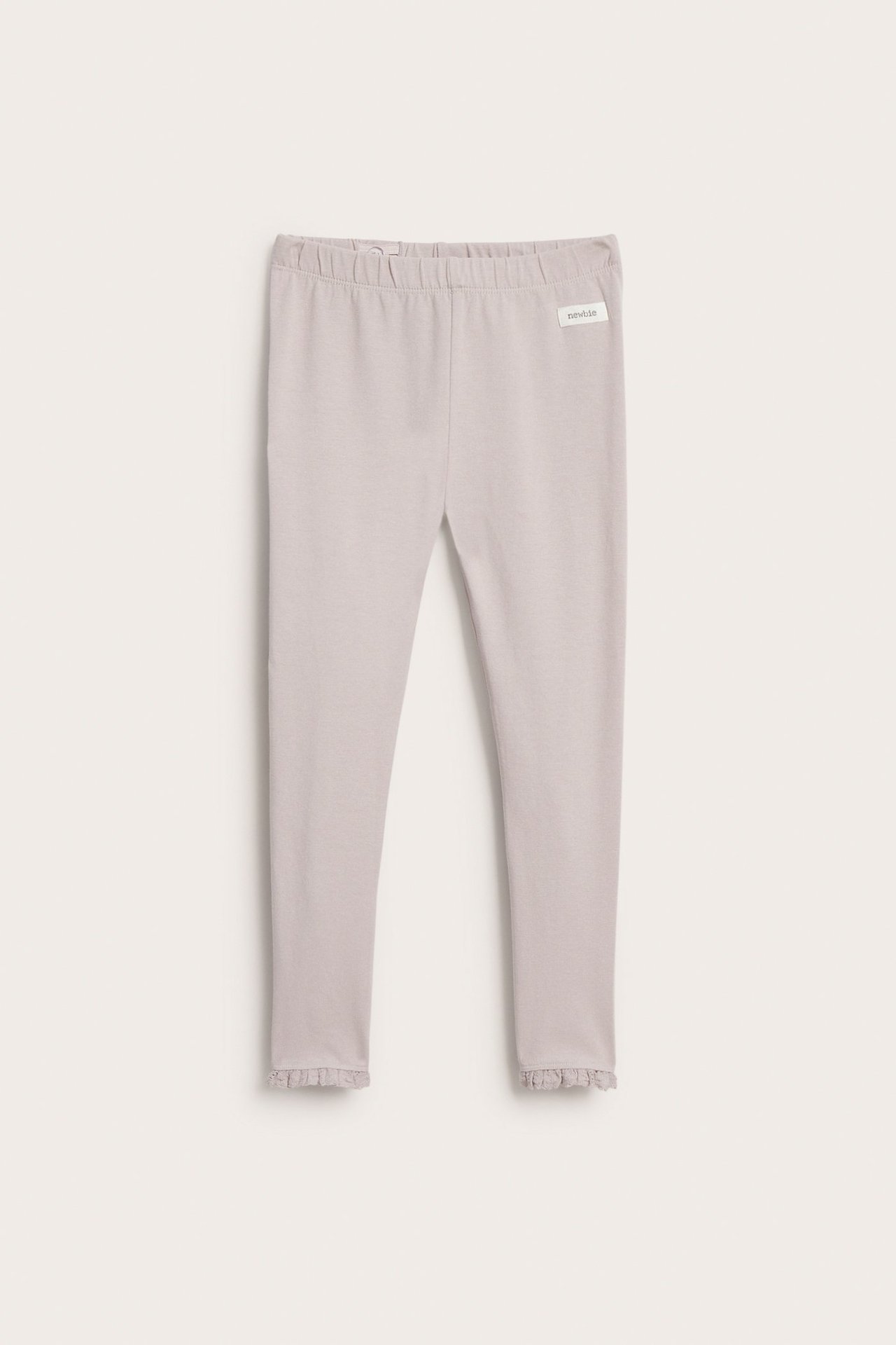 Vorderansicht von hellfliederfarbenen Jersey-Leggings mit Gummizugbund und Spitzenrüschen an den Knöcheln.