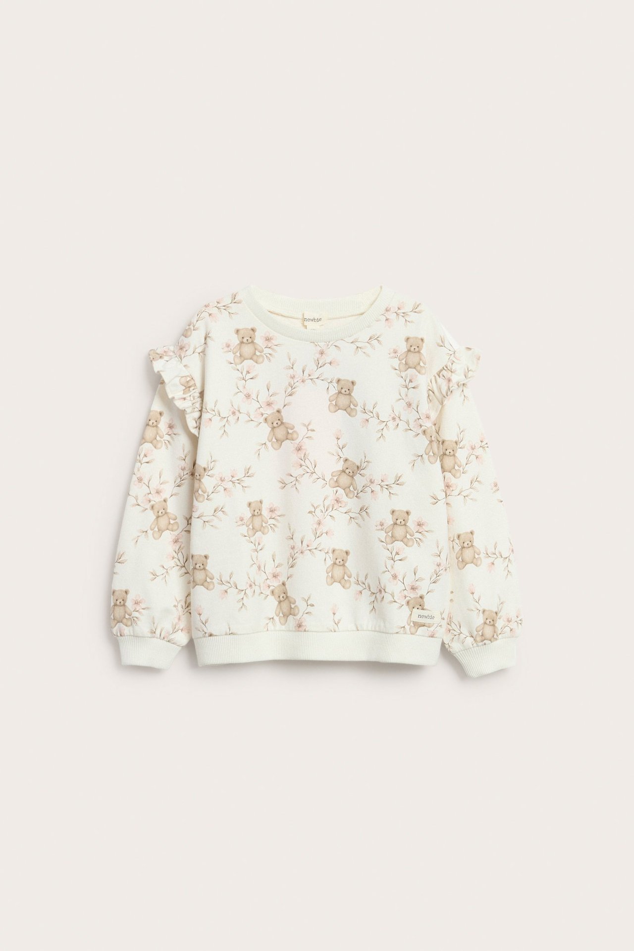 Offwhite Blümchen-Sweatshirt mit Rüsche an Schulter, gerippte Bündchen, für Mädchen.