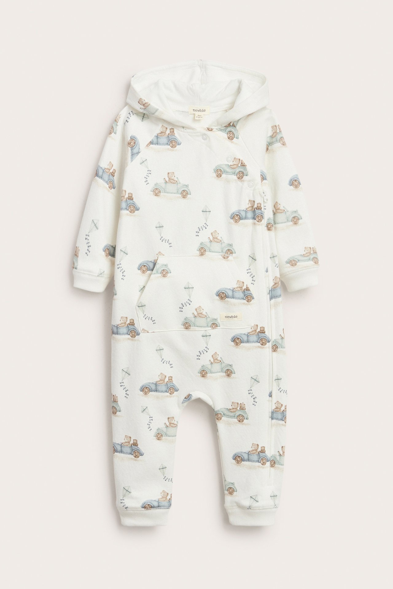 Offwhite jumpsuit with car pattern, hood, kangaroo pocket, snap buttons, rib cuffs, and cotton.