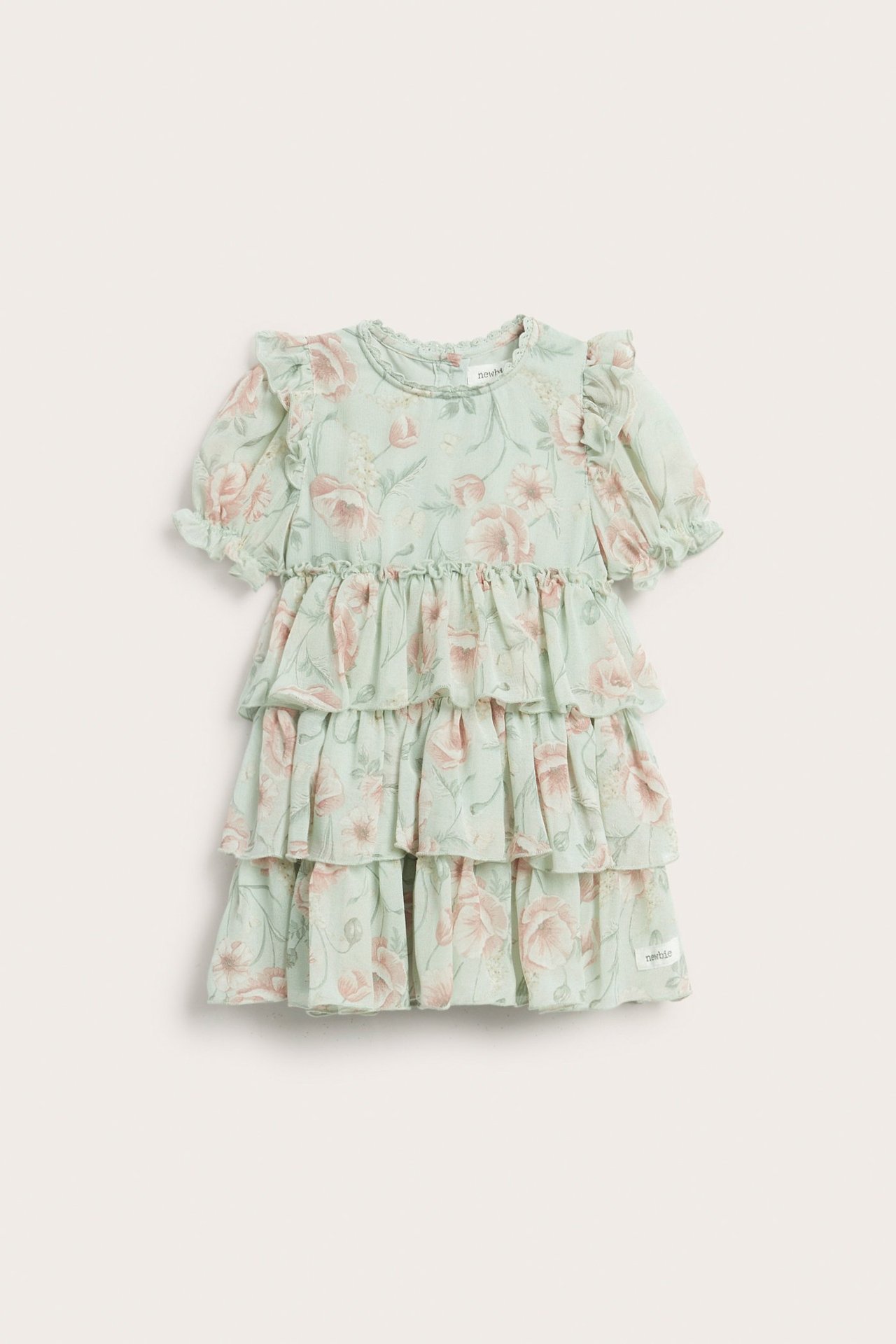 Vorderansicht eines hellgrünen Blumen-Chiffonkleides für Kinder mit Rüschen und Puffärmeln.