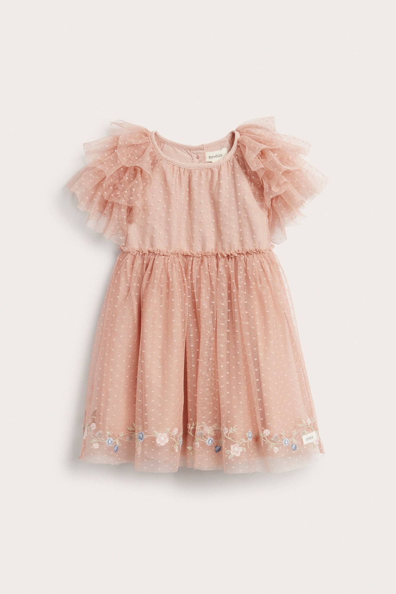 Vorderansicht eines pinkfarbenen gepunkteten Mesh-Kleides für Kinder mit gerafften Ärmeln und besticktem Saum.