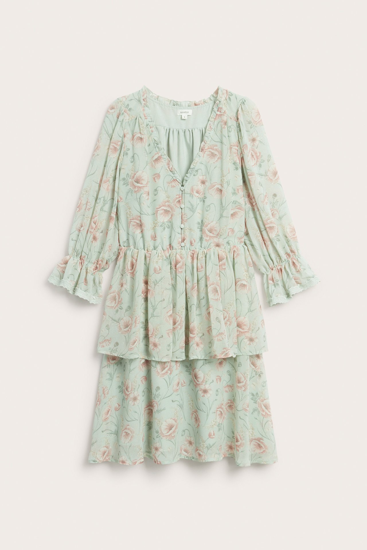 Front view of a women's light green floral chiffon dress, ruffled V-neck, buttons, elastic waist, tiered skirt.