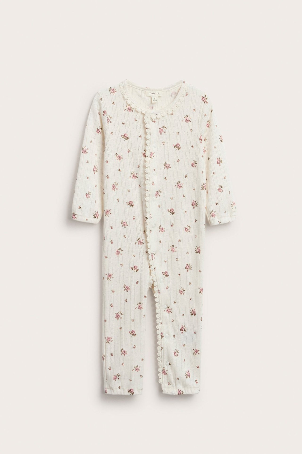 Elfenbeinfarbige, blumiges Jumpsuit aus Pointelle-Strick mit Spitzenrand, Baby.