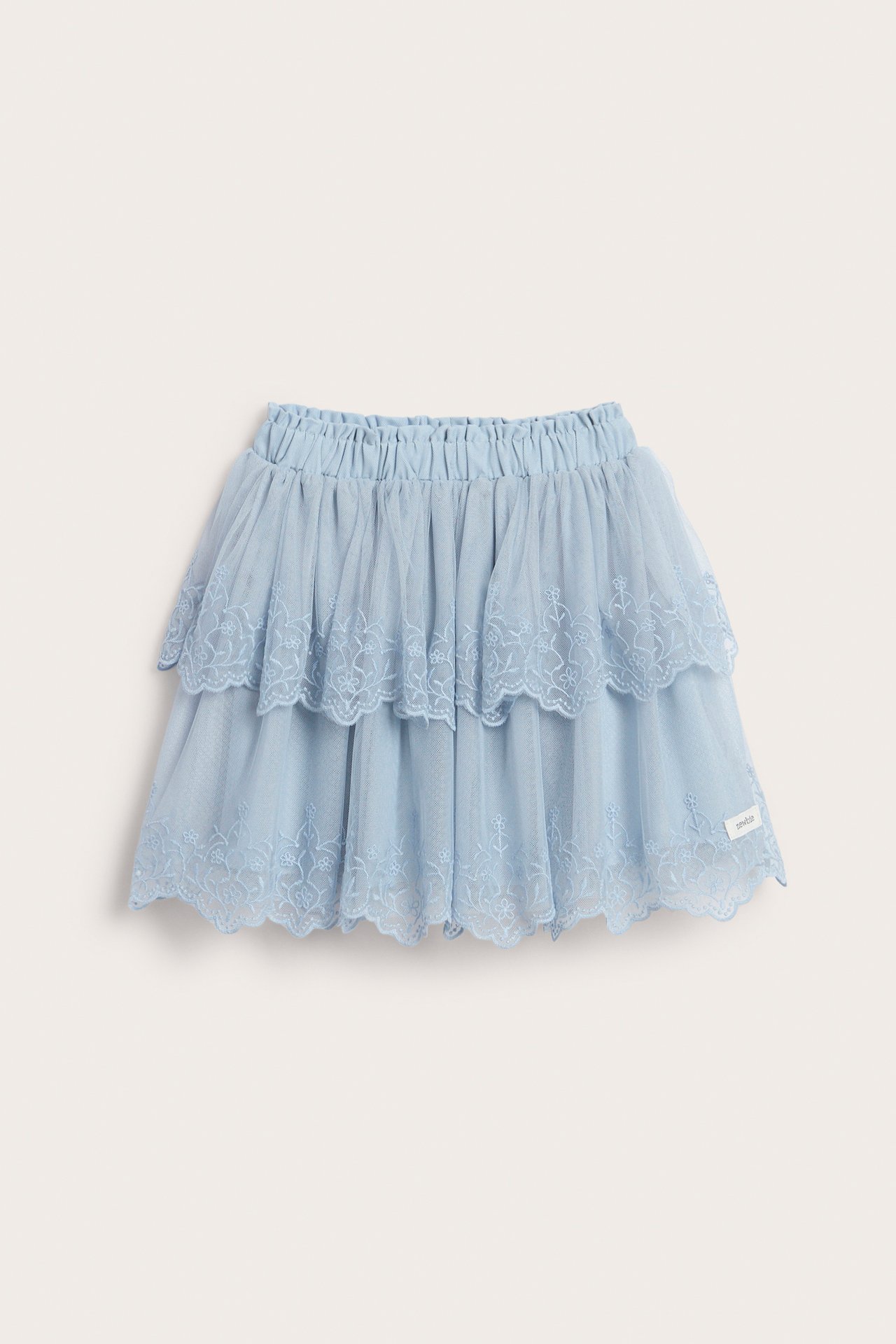 Front view of a kid's light blue tiered mesh skirt with floral embroidery and elastic waist.
