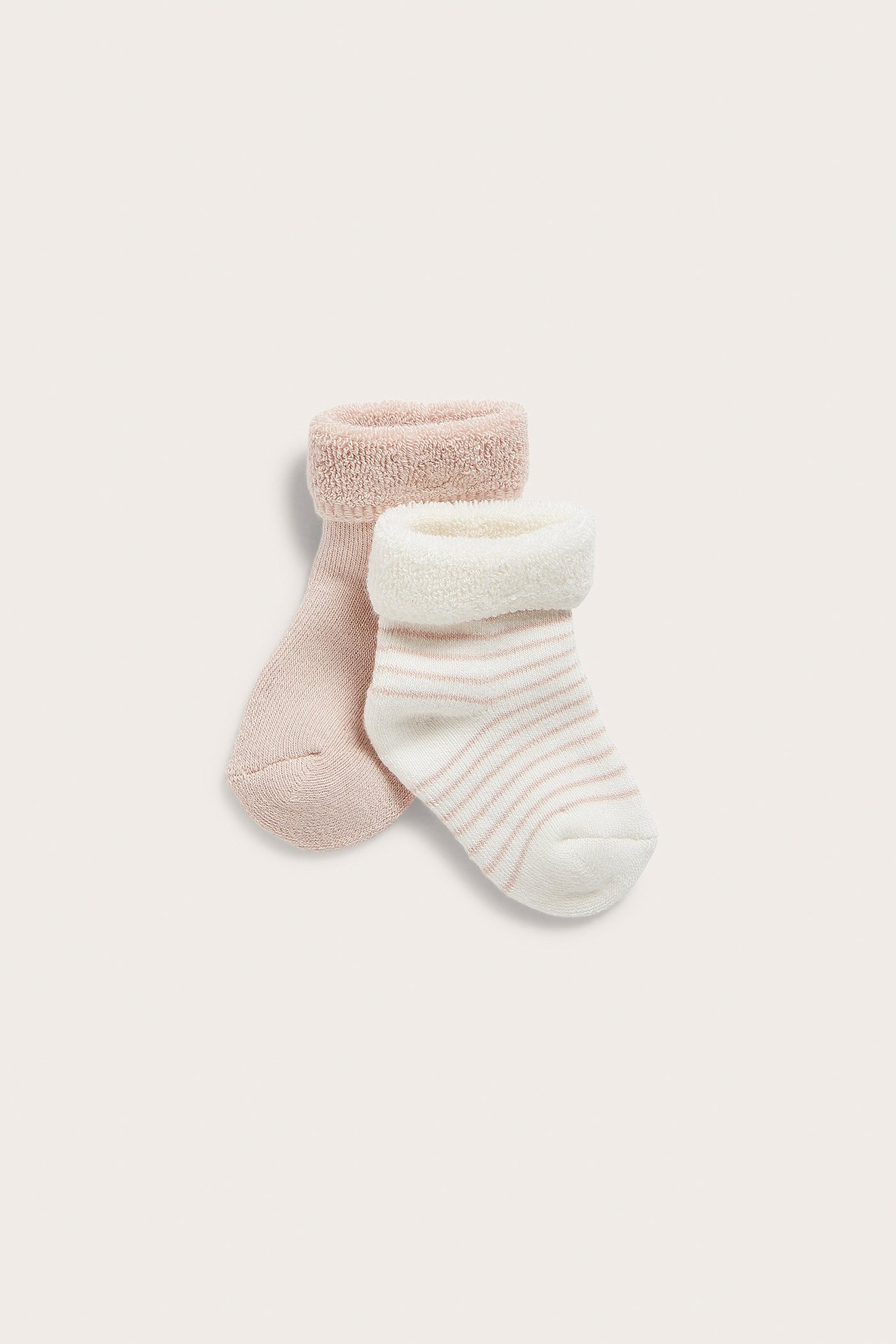 Front view of two baby terry socks: one light pink, one white with light pink stripes and folded cuffs.