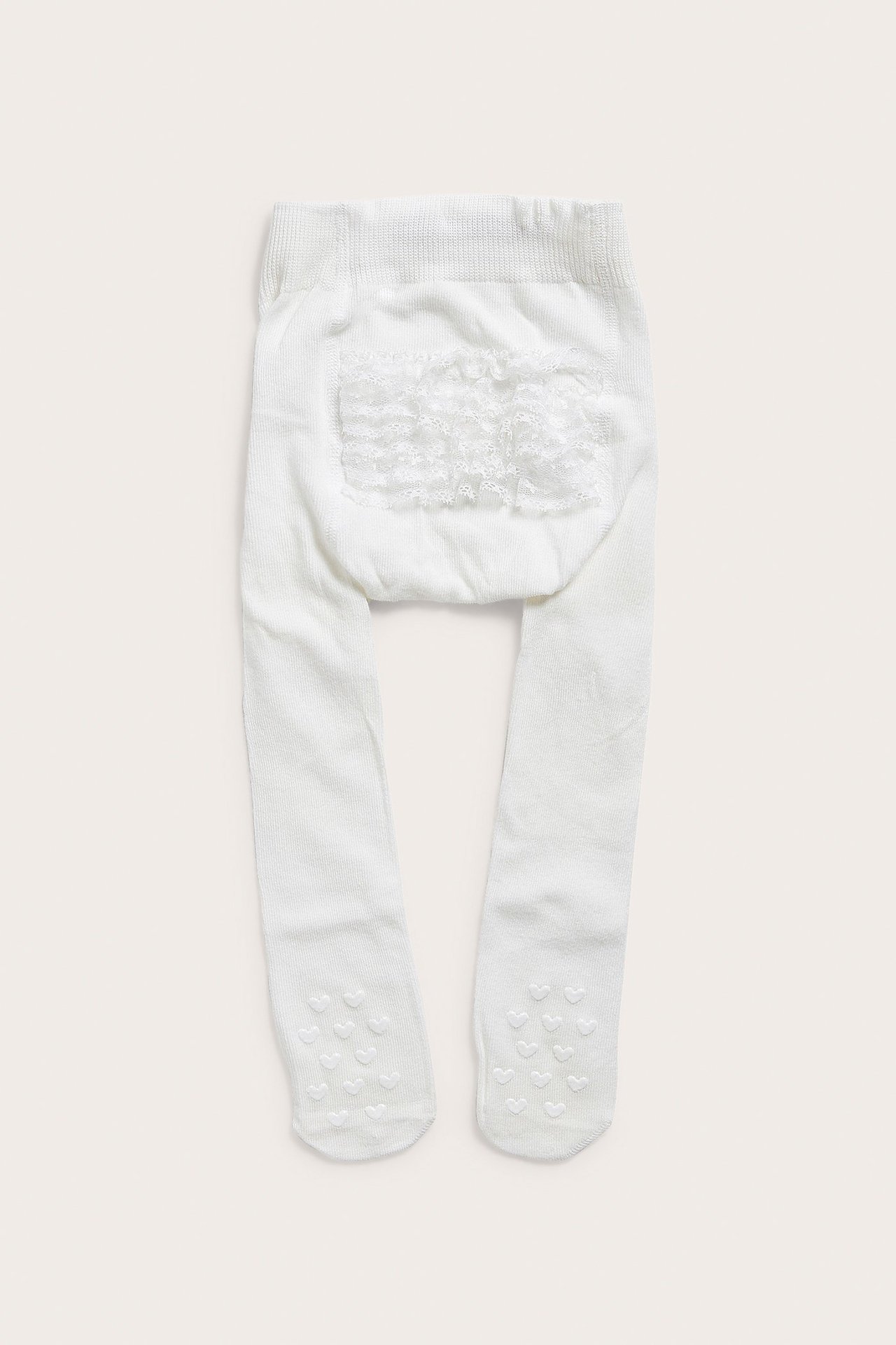 Weiche offwhite Strumpfhosen mit Spitze am Rücken, rutschfest, von Newbie, Größe 74/80.