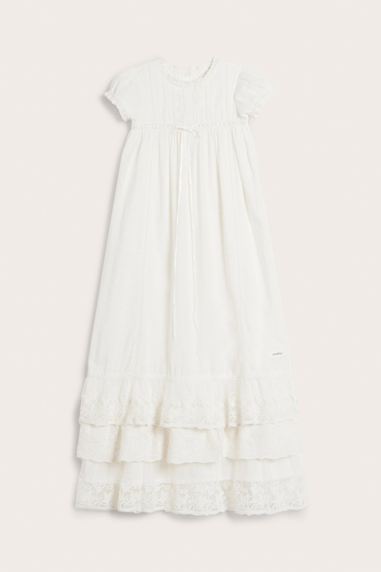 Front view: Off-white baby christening gown with short sleeves, pleated bodice, and long skirt with lace ruffles.